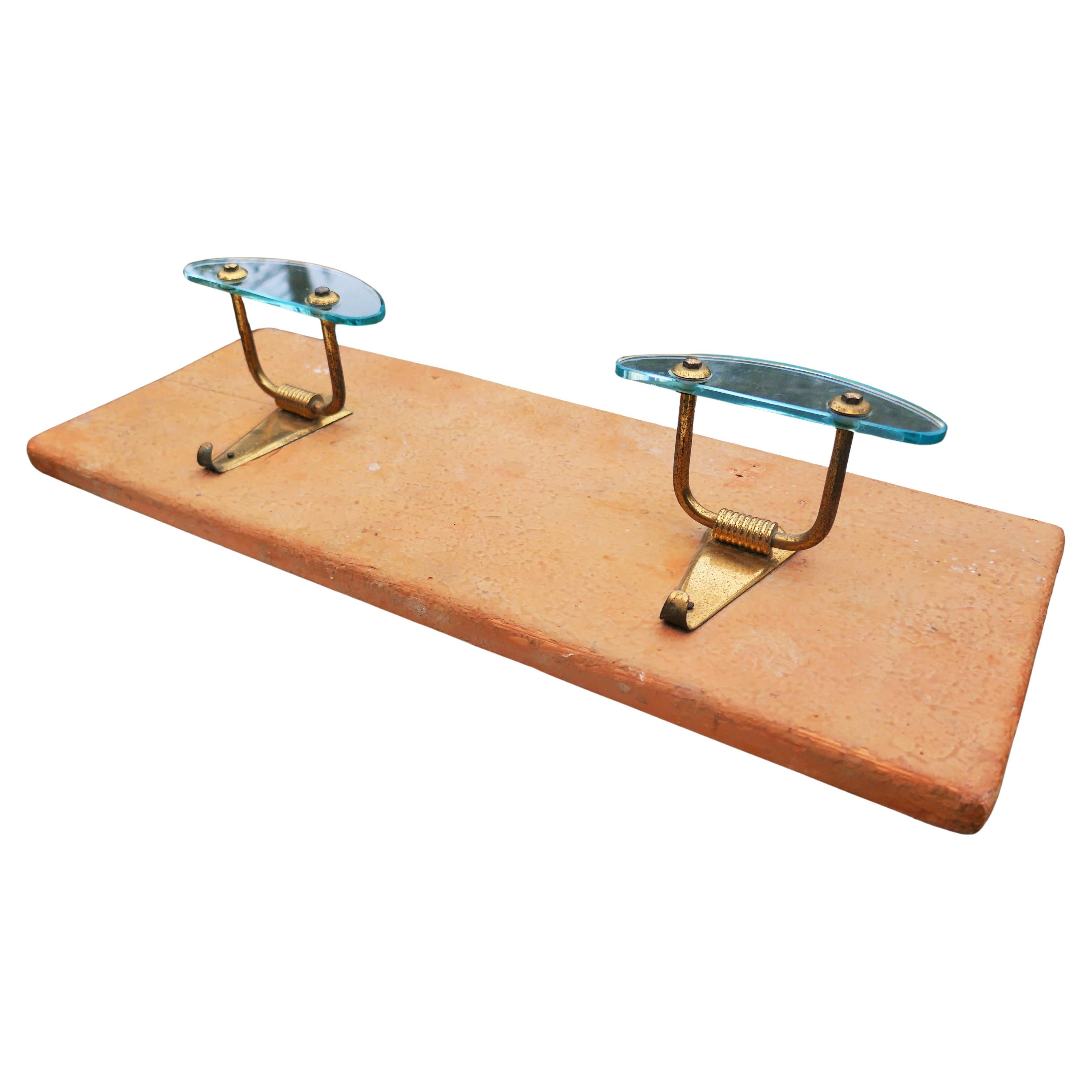 Glass and brass wall coat rack
Atelier Borsani style.
Good condition.
Thank you