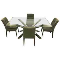 Table de salle à manger en verre et chrome et 4 chaises en calligaris