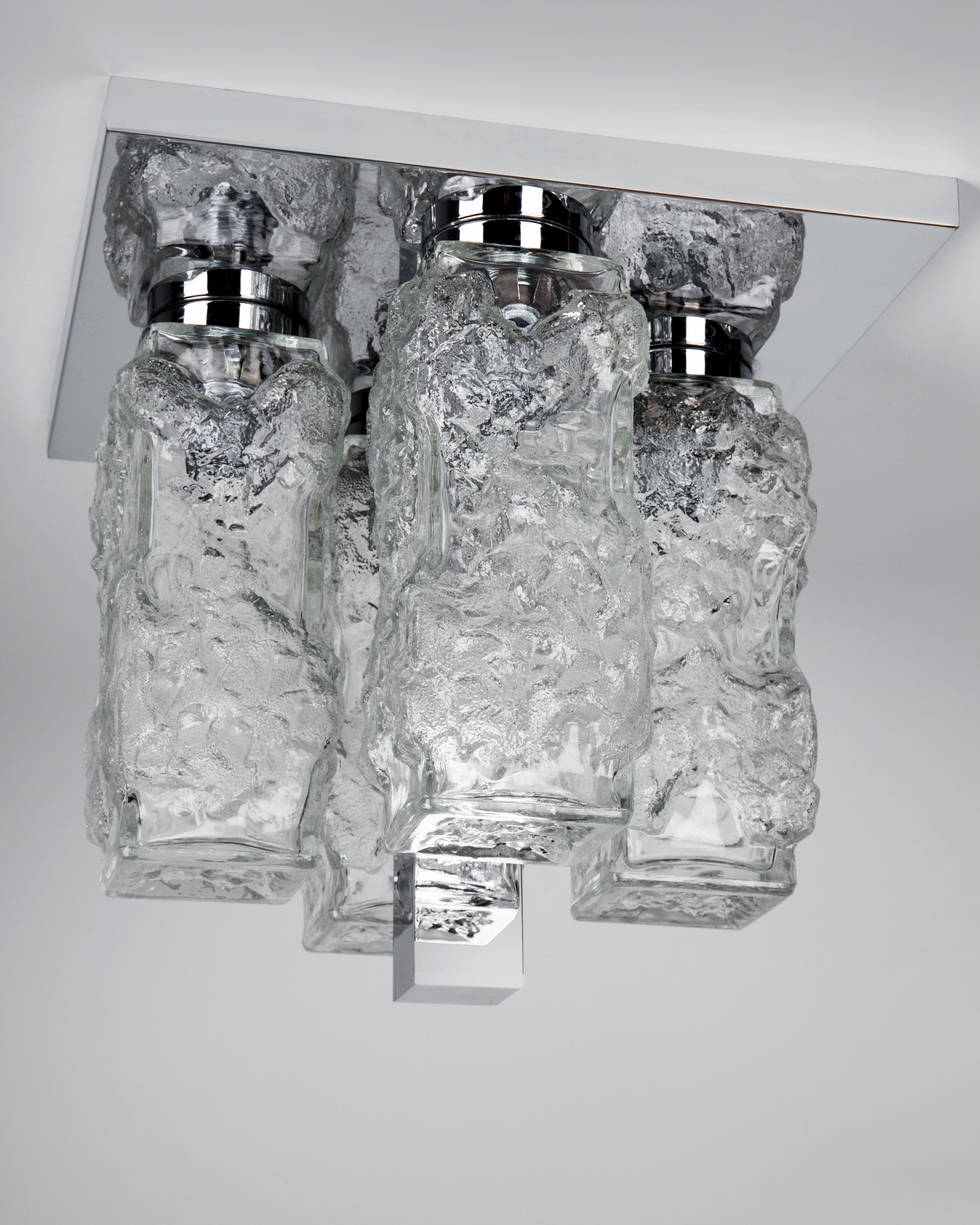 AHL4034
A vintage flush mount with heavily textured clear cast glass pieces in its original chrome finish. Due to the antique nature of this fixture, there may be some nicks or imperfections in the glass.

Dimensions:
Overall: 10-3/4