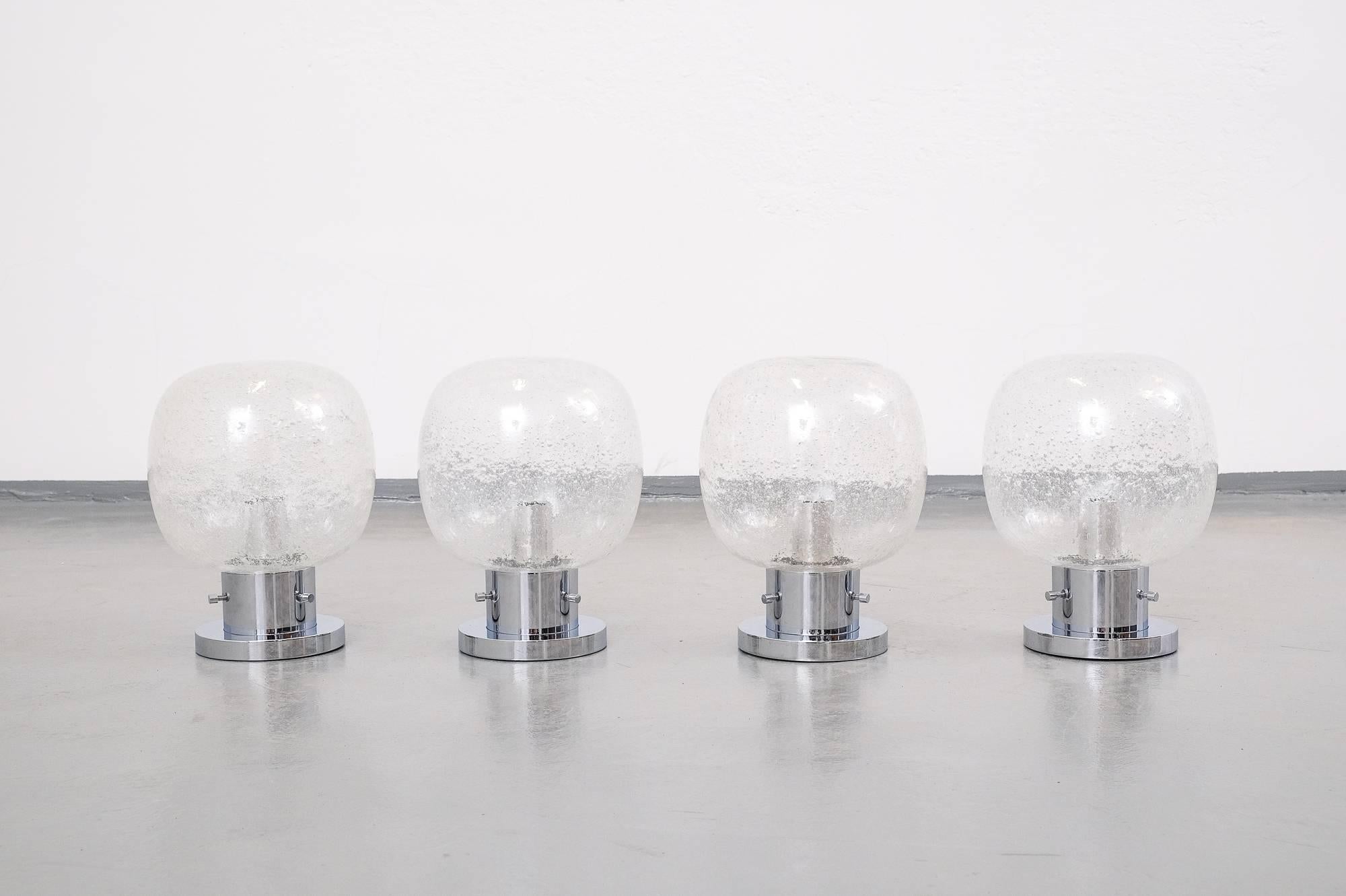 Bubbled glass and chrome flush mount globe lights or wall sconces by Limburg, Germany, 1970s. E27 socket and maximum 100 watts.

NOS, so they have never been used!