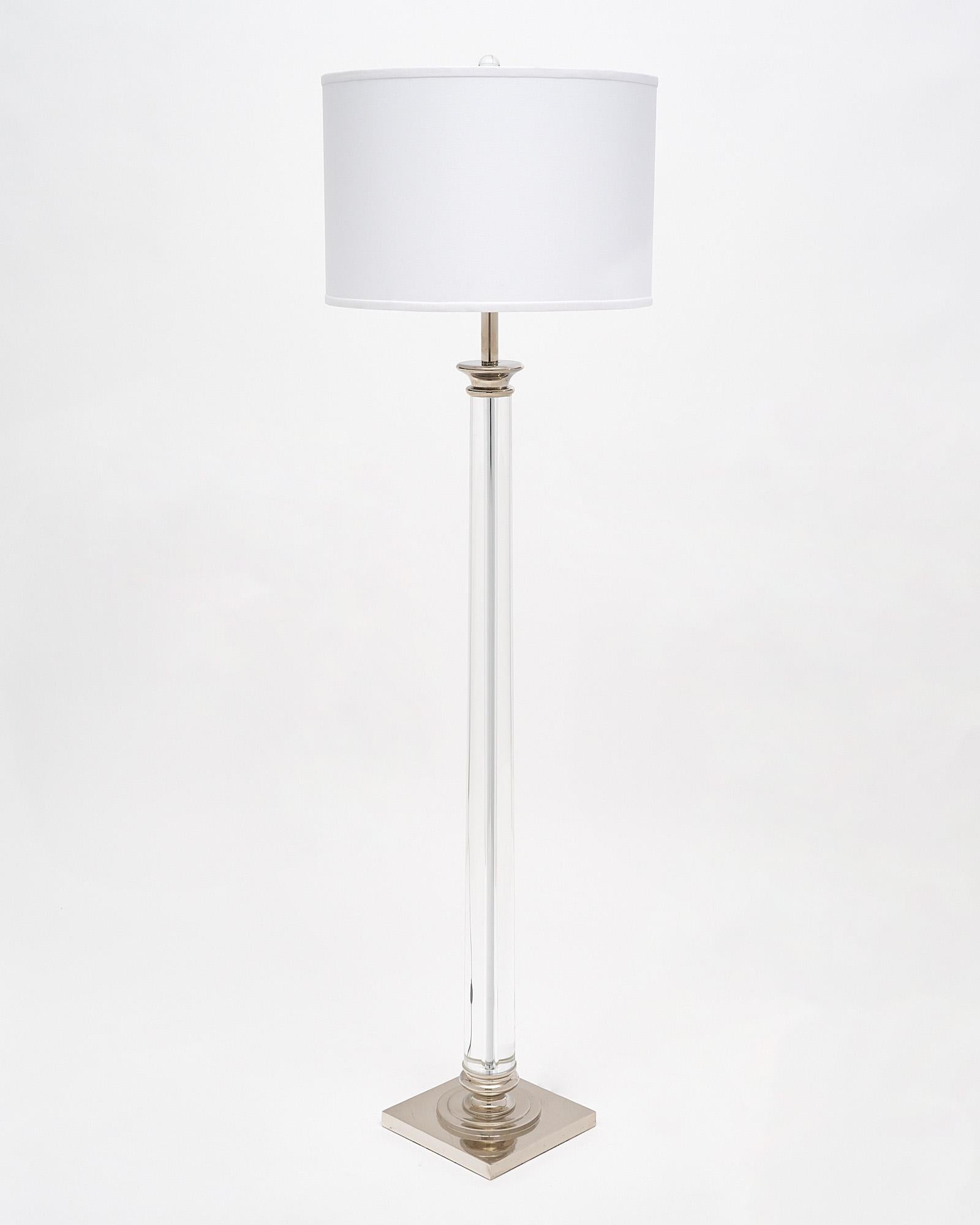 French floor lamp with a glass column structure and a chrome base. It is topped with a glass finial. This piece has been newly wired for US standards.