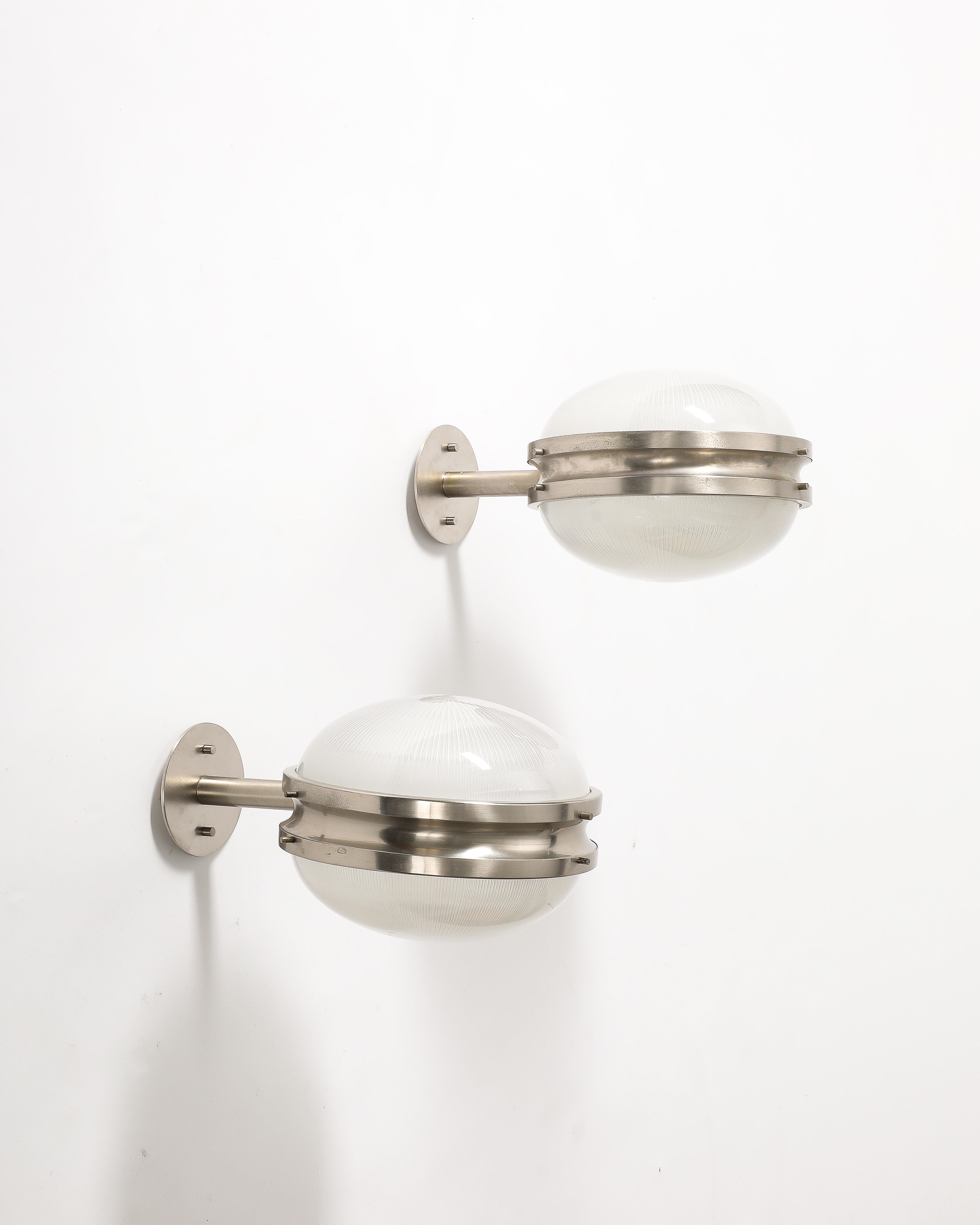 Two available; priced individually.

Steel and glass sconces by Sergio Mazza for Artemide. These sconces contain Mazza's easily recognizable cast glass shades.