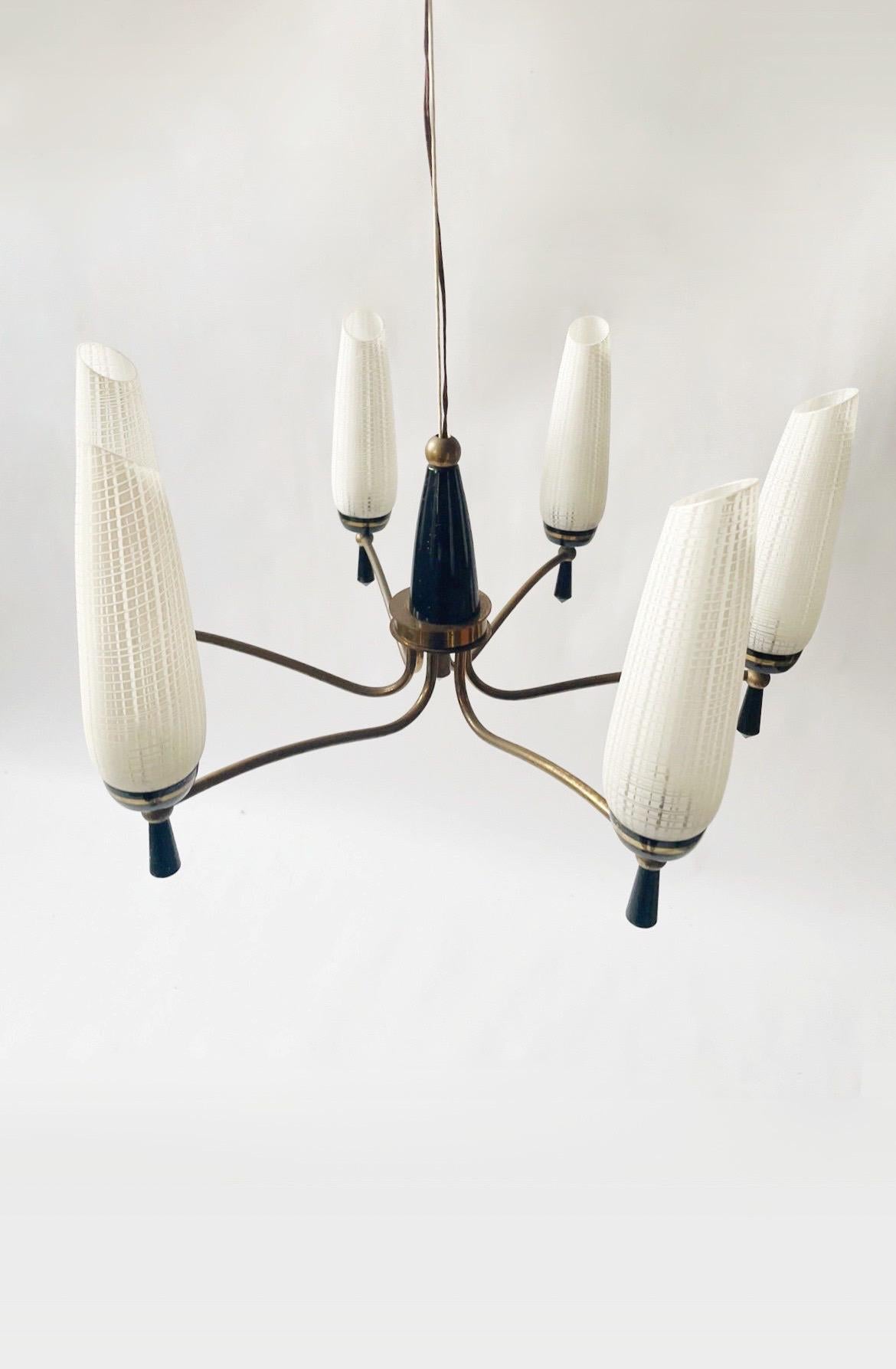 Beautiful vintage chandelier from Italy ca. 1960. Excellent condition for its age, glass shades have no chips or cracks. Original exposed wire makes the length of the fixture adjustable.