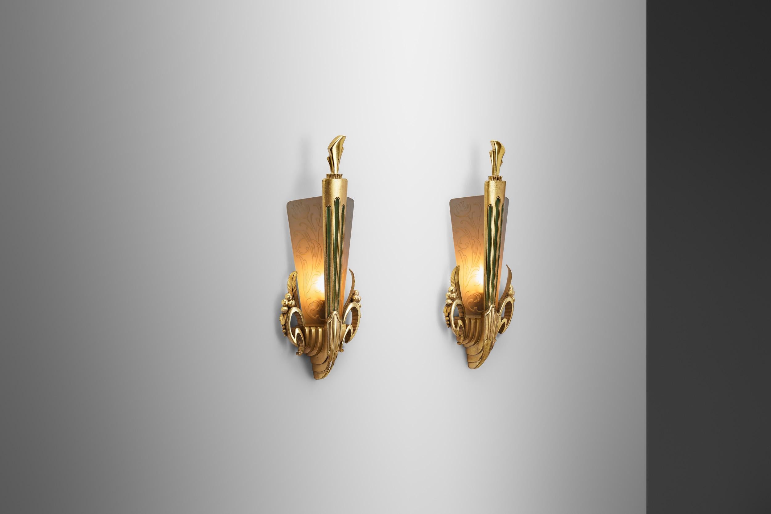 Standing as evidence of the inventiveness and timeless glamour of Art Nouveau is this pair of ornamented wall lights. These lights were designed to show off the dynamic elegance that symbolized the era’s rich cultural scene in Europe and even today,