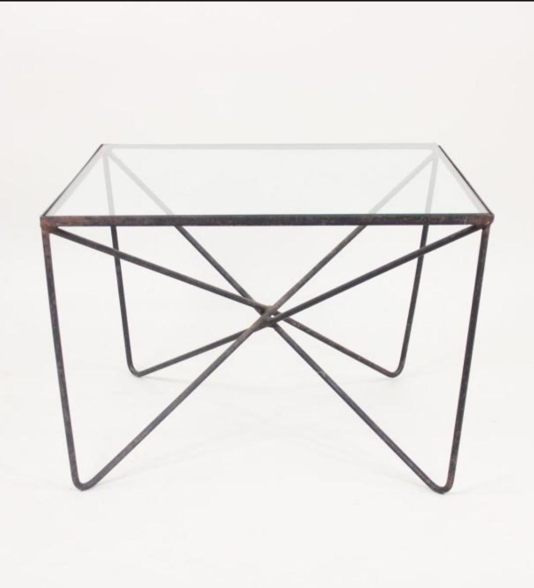 Minimalist table with frame of welded wrought iron and glass top. American by Luther Conover, 1950’s
Dimensions: 15.5h x 22.5w x 22.5d.
This item can be viewed in person at The Berkshire Galleries of Great Barrington Massachusetts.

