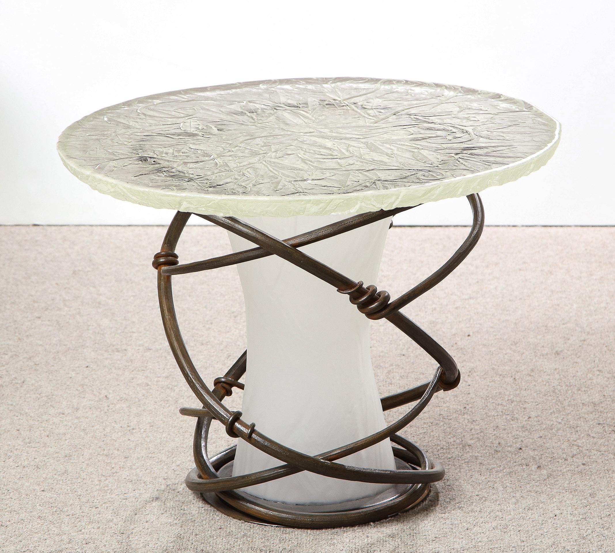 Cast Iron and etched floral glass end table.
Signed on edge of glass.