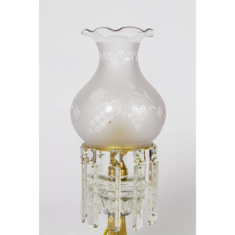 Electrified oil lamp, clear cut glass font, colonial crystals, column form base with marble. Beautiful frosted and cut glass shade.

Material: Onyx,Bronze
Style: Neoclassical,Victorian
Place of Origin: United States
Period made: Early 20th