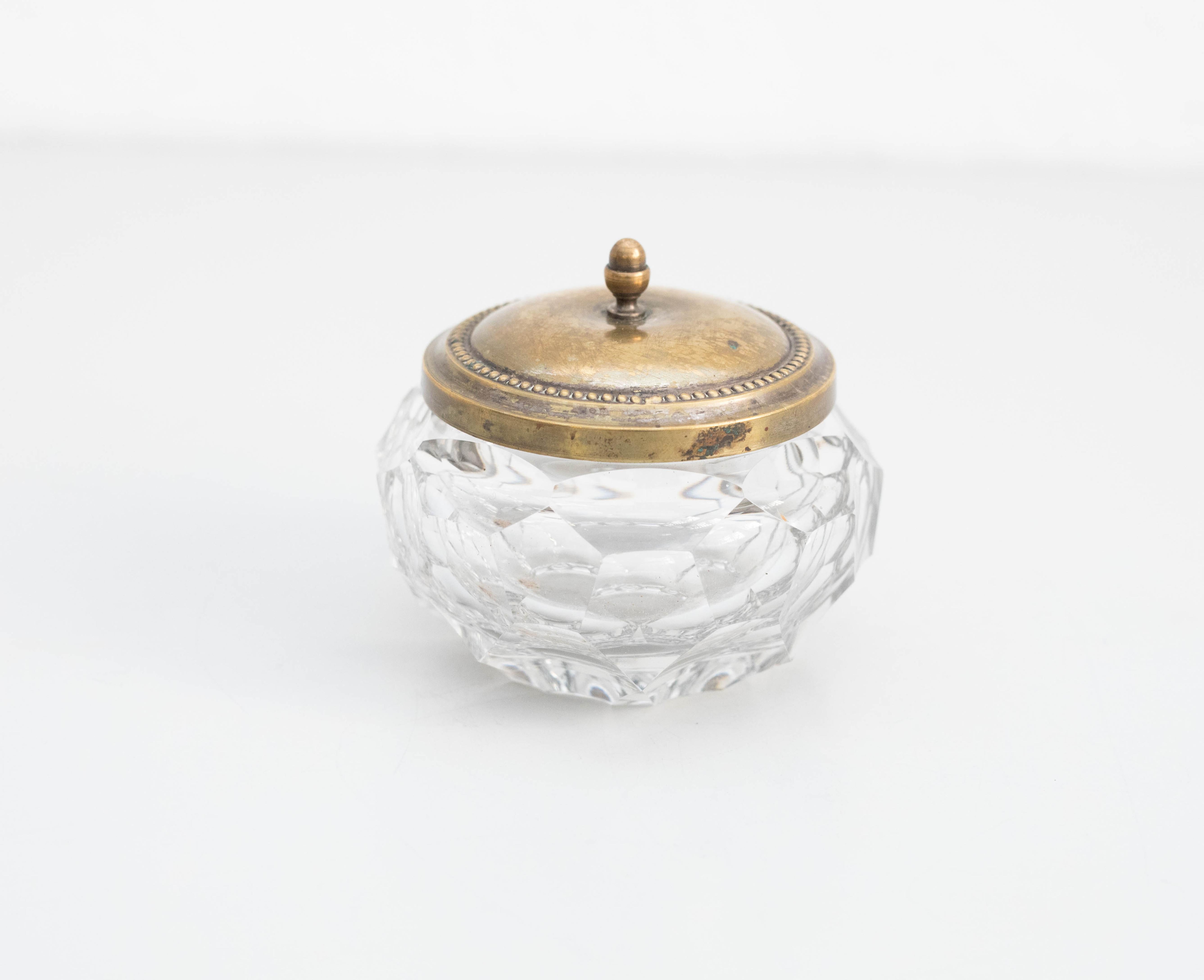 Glass and metal sugar bowl, circa 1930
Manufactured by Unknown, Spain.

In original condition with wear consistent of age and use, preserving a beautiful patina.

Material:
Glass and metal

Dimensions:
Ø 13.5 cm x H 10 cm.