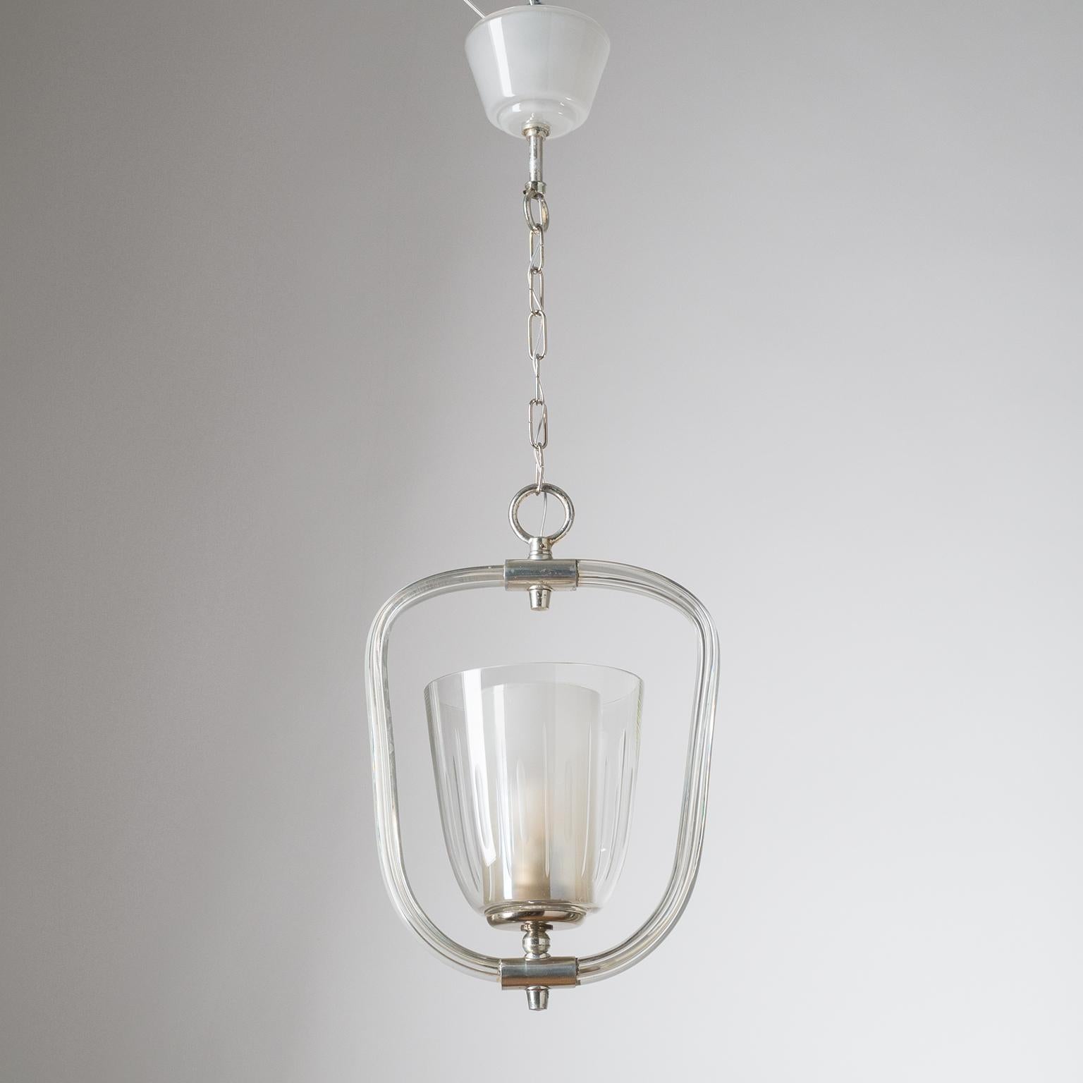 Fine Austrian glass lantern from the 1930-1940s. All blown-glass body with dual glass diffusers - the outer in clear glass with cut decorations, the inner glass is frosted with a slightly iridescent coating - and frosted glass canopy. Metal parts