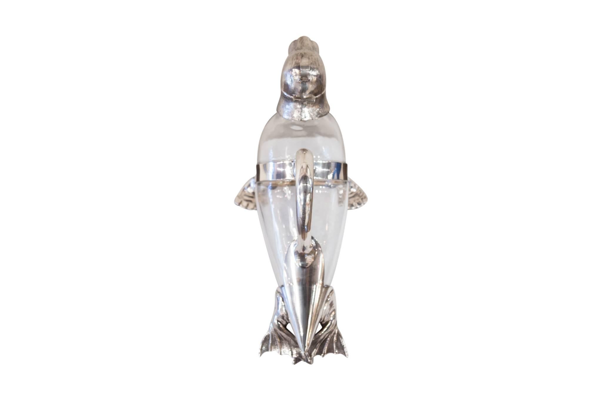This beautiful glass and silver plated walrus claret jug, circa 1930 makes the prefect addition to any wine cabinet, bar top, or display case!