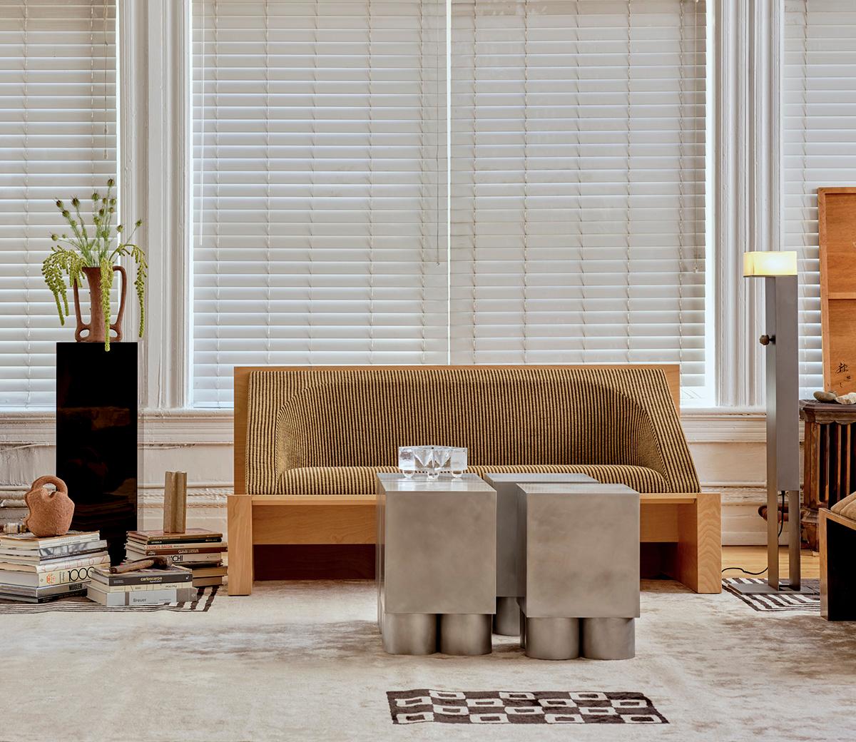 Delicate hand-blown glass and patinated steel combine to striking effect in this atmospheric table lamp that sets the mood with an alluring soft glow. The layered, mold-blown glass has been handcrafted to create a distinct effect to diffuse light.
