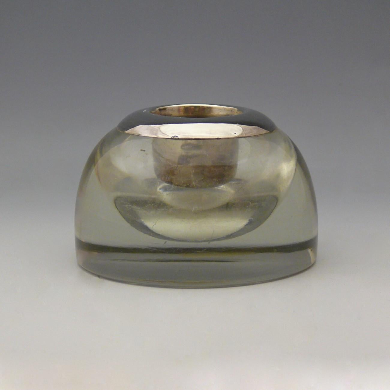 A fine glass match safe with sterling silver collar hallmarked, London, 1926.

Dimensions: 9 cm/3⅝ inches (diameter)

Bentleys are Members of LAPADA, the London and Provincial Antique Dealers Association.