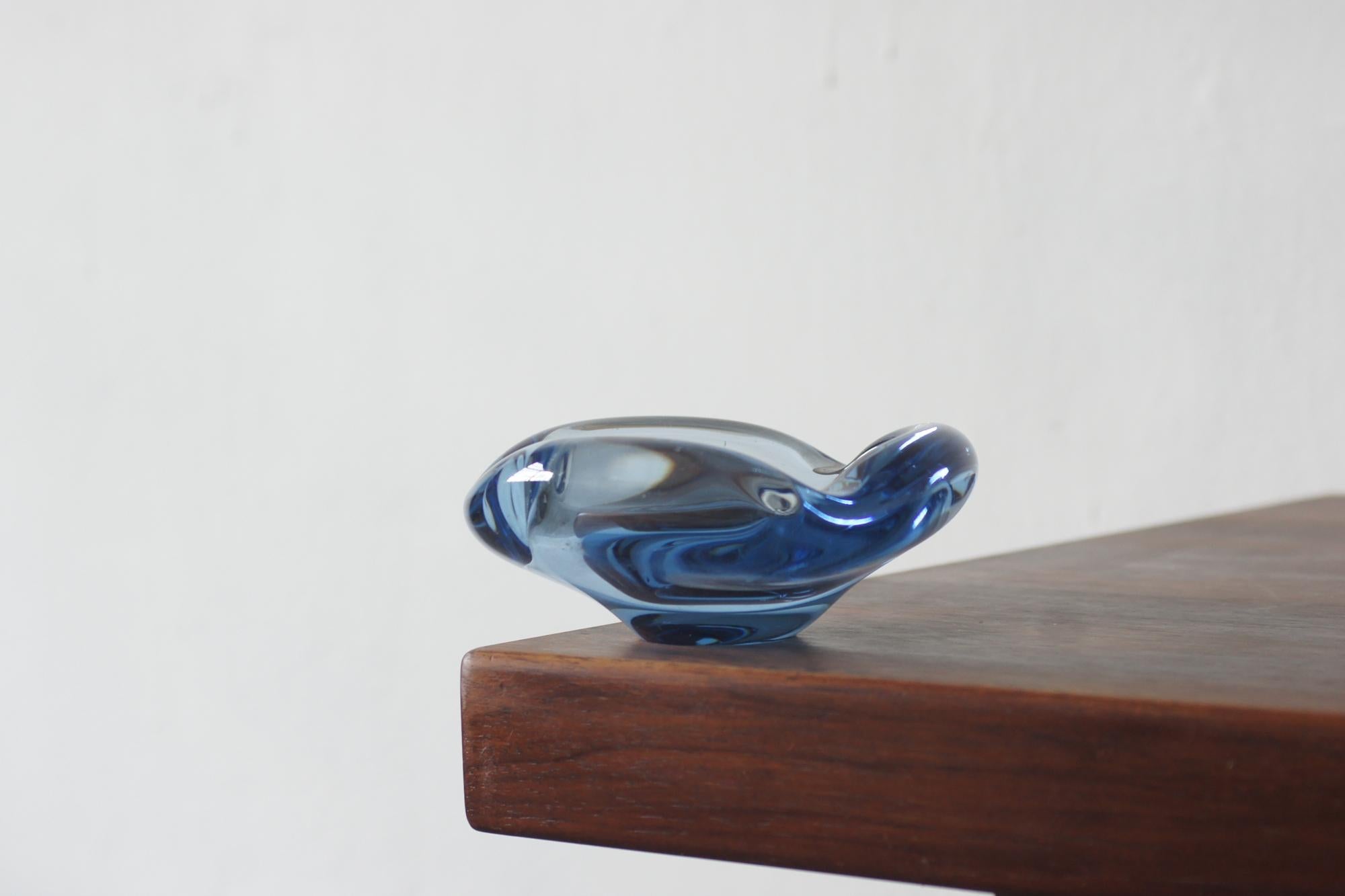 The glass bowl designed by Per Lütken for Holmegaard is one of the most recognizable examples of Danish art glass of the 20th century. Lütken, chief designer at the renowned glassworks for more than four decades, created vessels that combine the