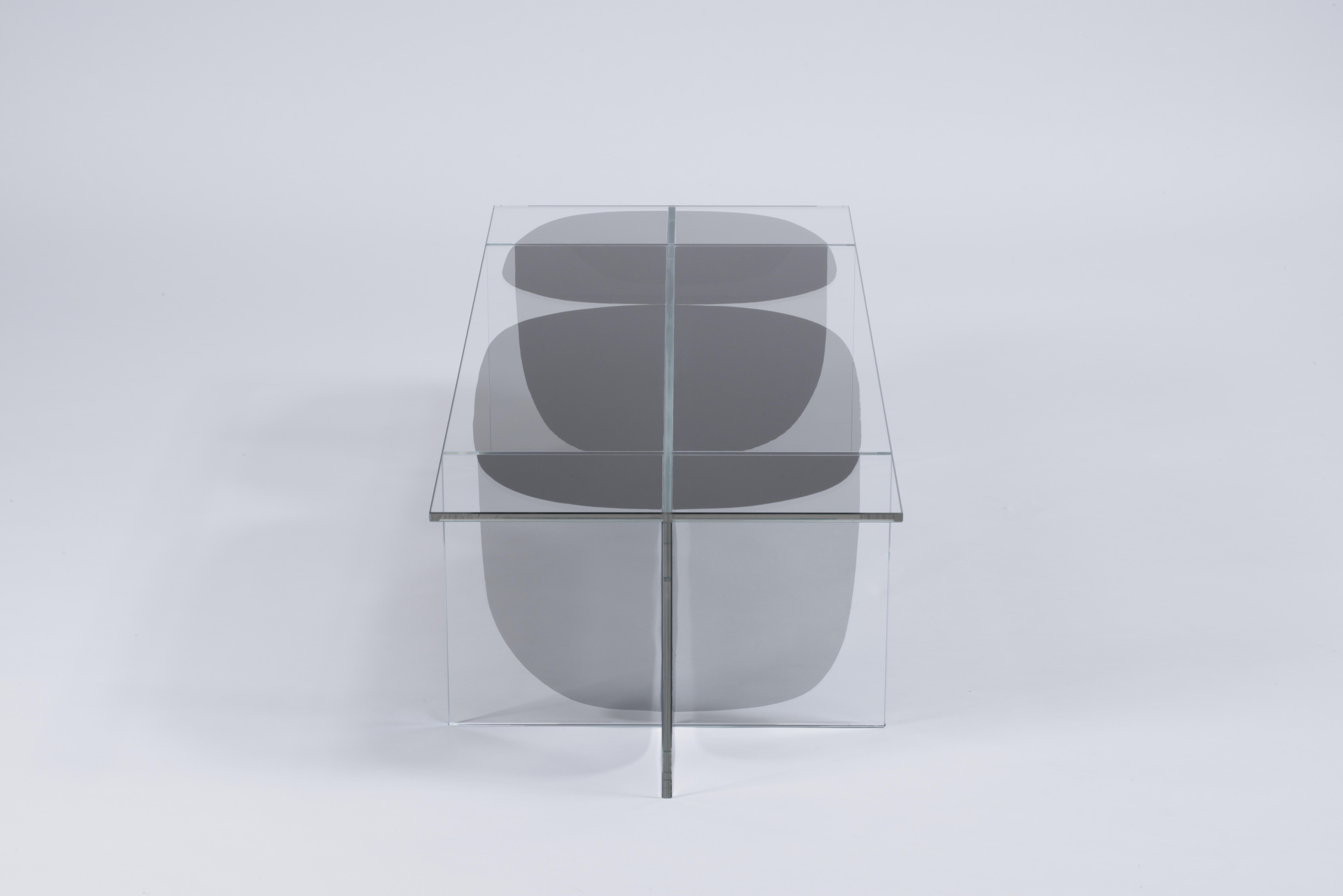 Bipolar coffee table by Oskar Peet and Sophie Mensen

Dimensions: 110 x 45 x 30 cm
Another option: Small version coffee table: 45 x 45 x 46
Materials: glass and flterd laminated
Weight:
Coffee table: 27 kg
Small version coffee table: 13