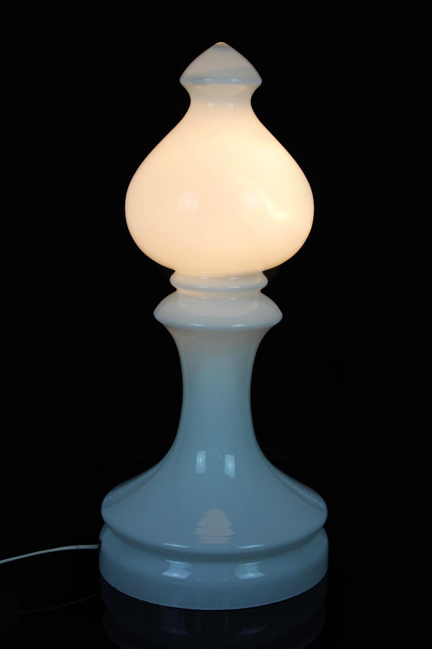This glass lamp, made of milk white glass in a shape of a chess bishop, was designed by Ivan Jakeš and produced by Osvetlovací Sklo Valašské Mezirící in Czechoslovakia in the 1970s. Lamp in very good vintage condition, fully functional.
 