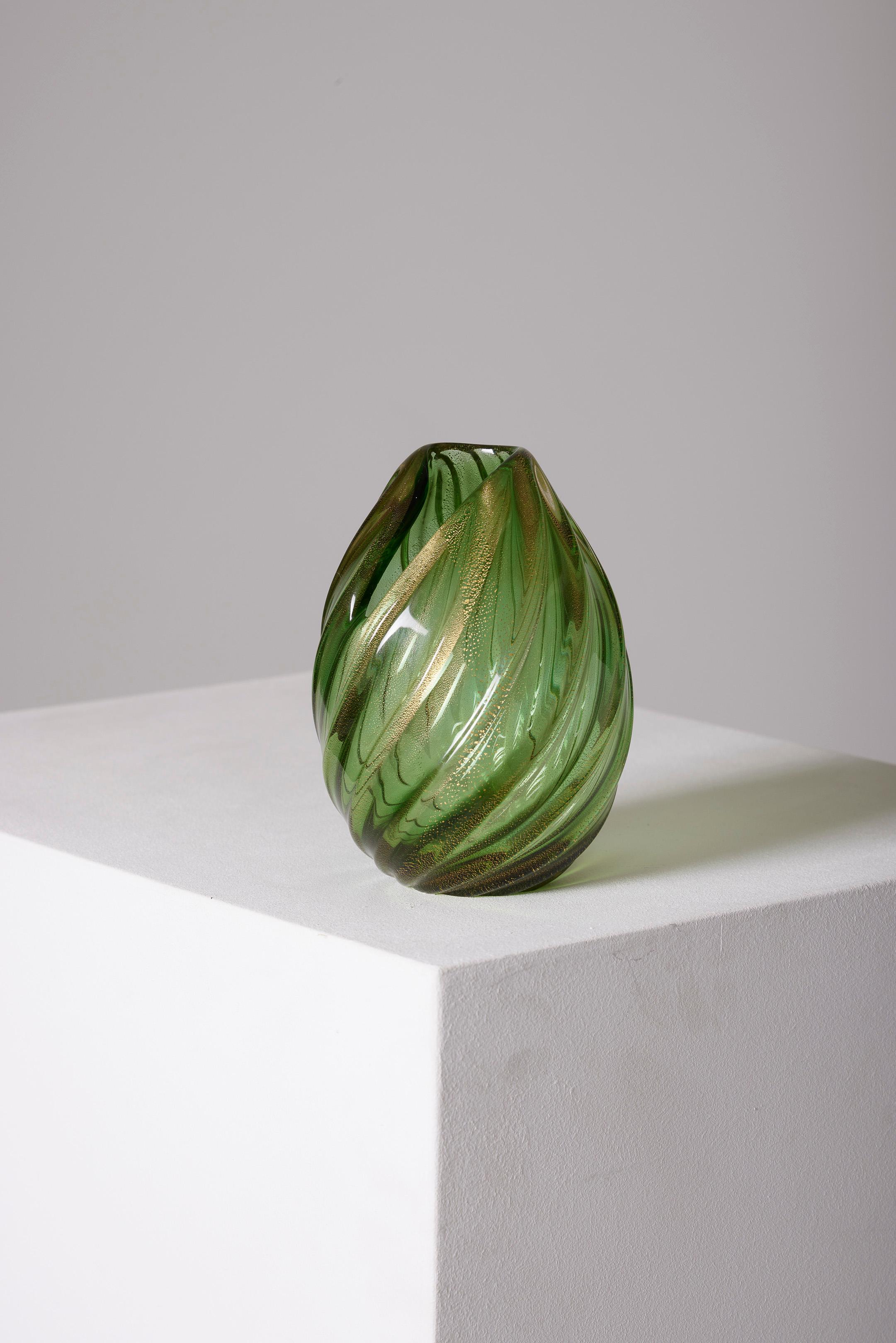 Glass blown vase from Murano signed by Archimede Seguso, handmade in Italy. This vase showcases ribbed iridescence in a stunning shade of green, with applications of ribbed bands tinted with gold and green. The vase has been crafted with great care