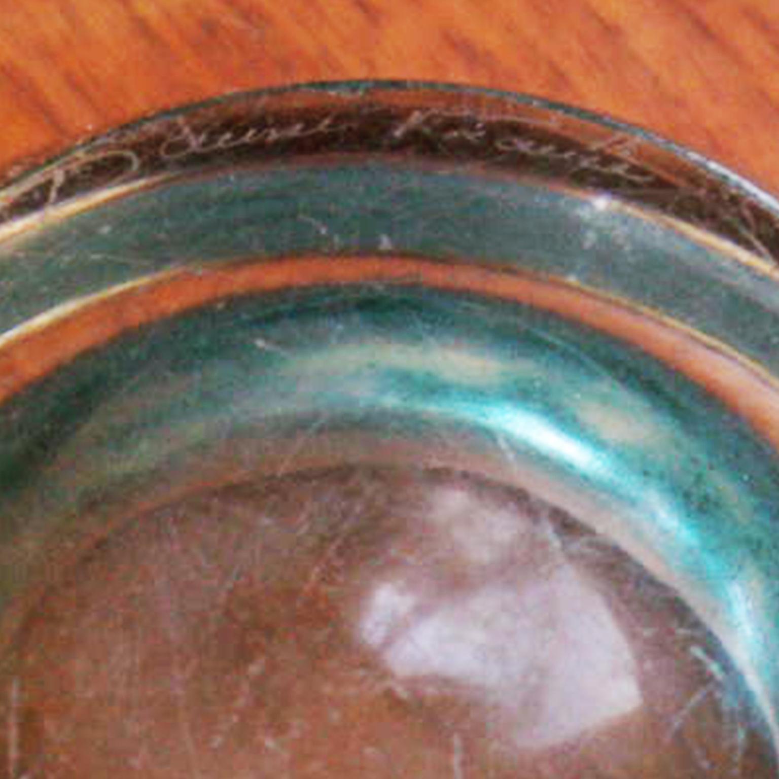 Heavy glass bowl by Daum with a delicate thin layer of glass with blue and green touches.
Signed Daum on the base
Year 1960
Measures: H about 5 cm
Diameter about 11.2 cm
Diameter of the base about 7.2 cm.
Daum is a crystal studio based in