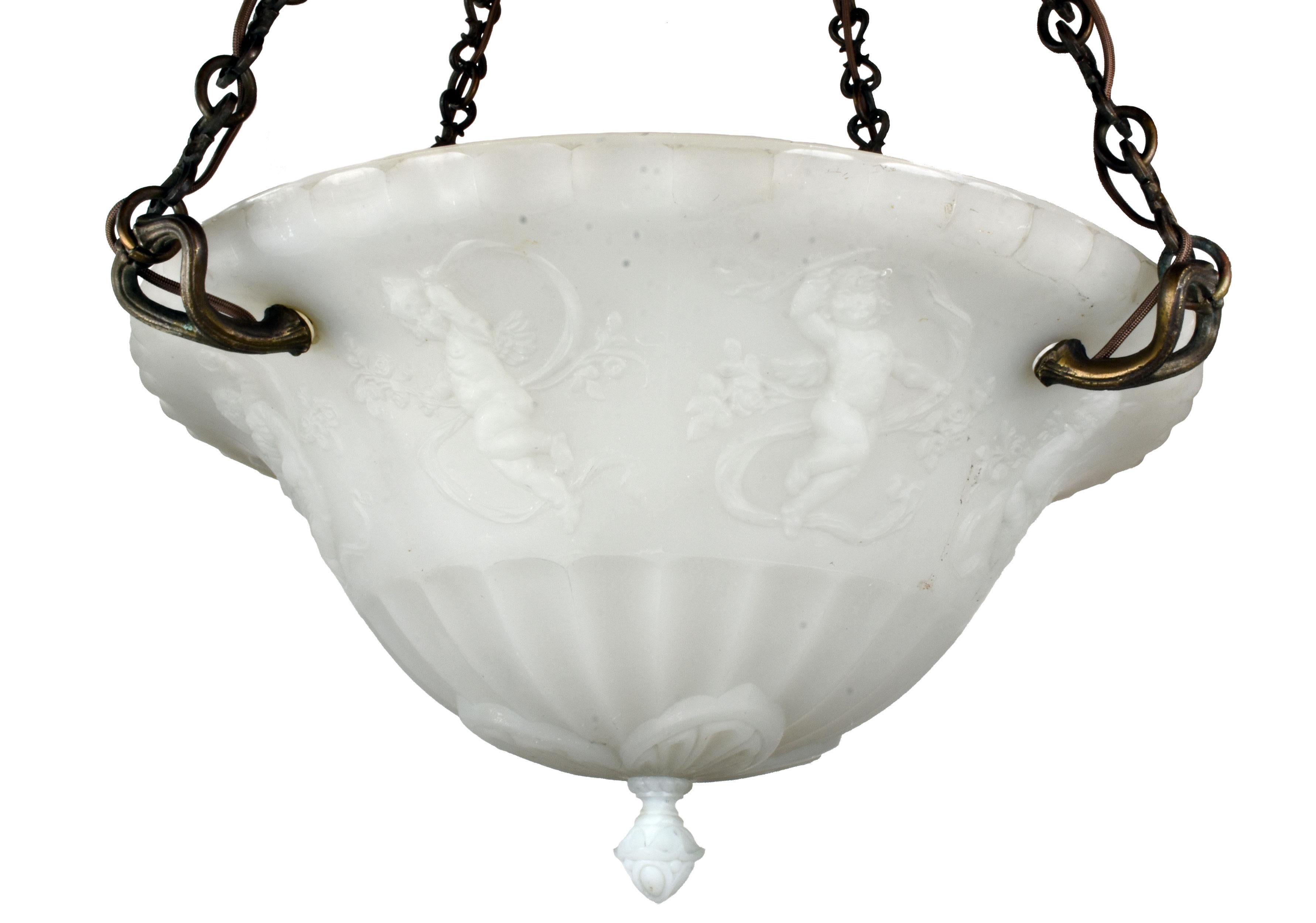 This impressive and gorgeous chandelier is adorned with dancing putti designs that bestow it with a unique playful spirit. When illuminated, the entirely cast glass bowl gives off a pleasantly warm radiance which even further showcases the