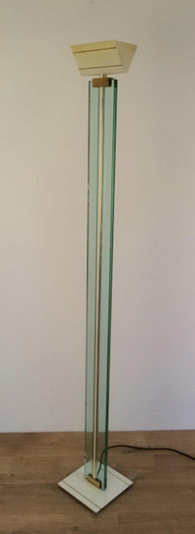 Glass, brass and lacquered metal floor lamp. Circa 1970.