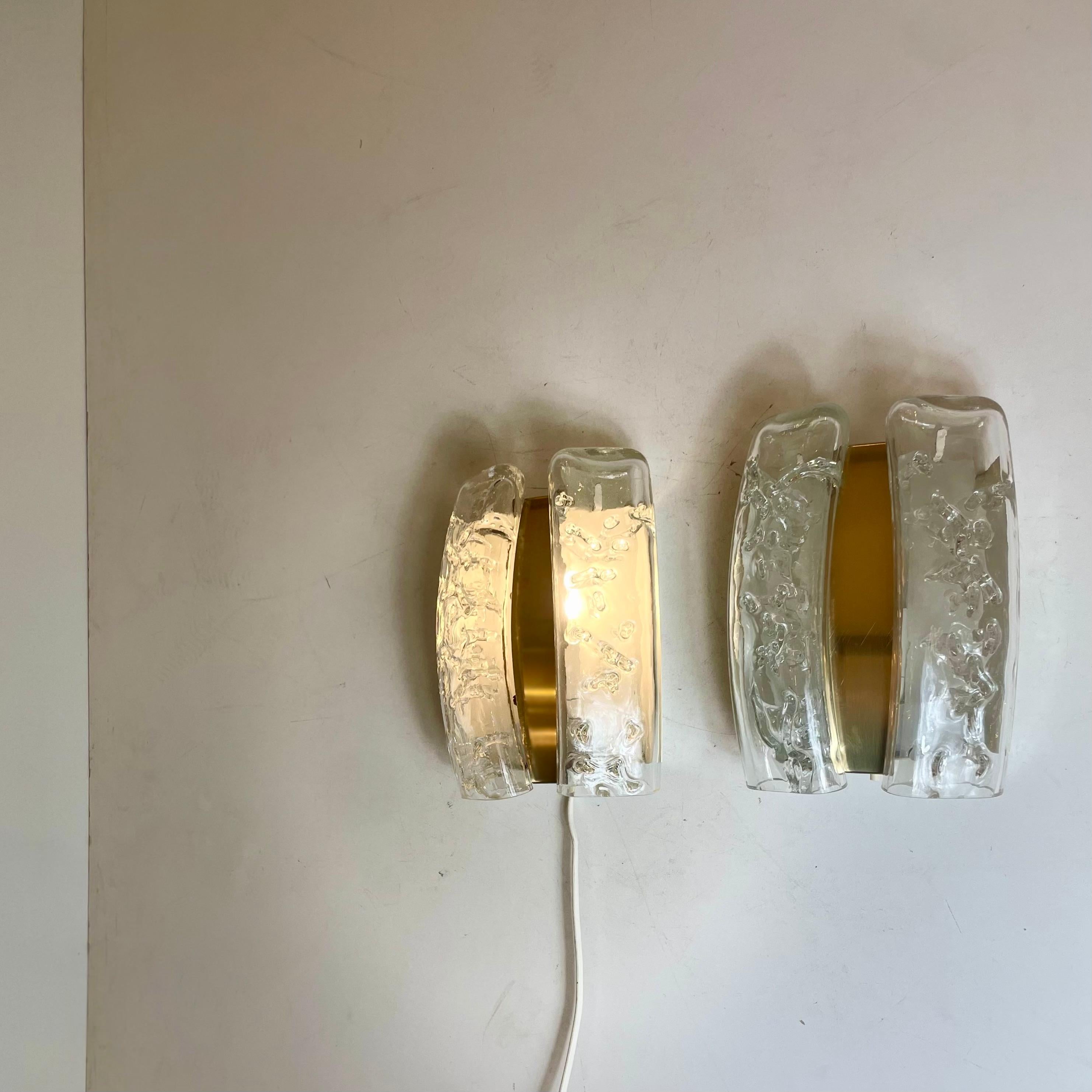 Pair of high-end wall lights made of tubular melted glass suspended on a brass base. Designed by the iconic firm Doria in Germany in the 1960’s.
-
Designed by: Doria Leuchten
Produced in: Germany
Design period: 1960s
Materials: glass, metal
Color: