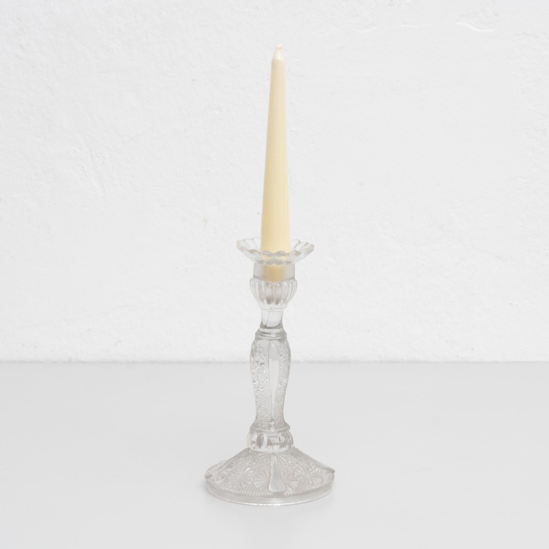 Glass candle holder, circa 1960.

By Unknown manufacturer. Spain.
In original condition, with minor wear consistent with age and use, preserving a beautiful patina.

Materials:
Glass.

 