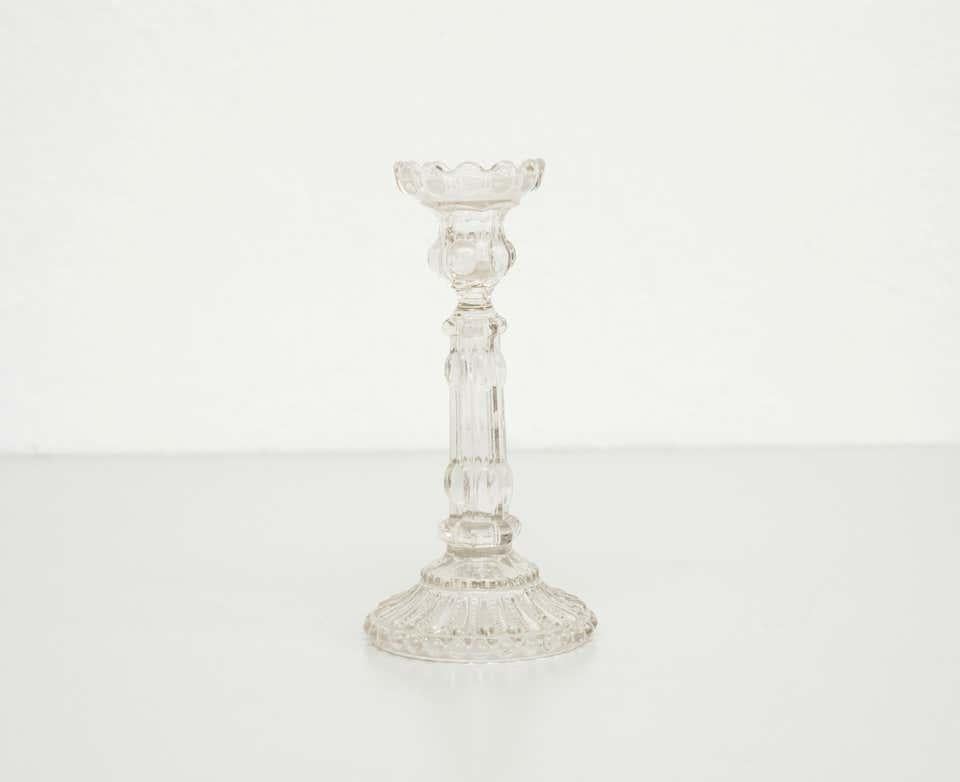 Glass candle holder, circa 1960.

By Unknown manufacturer. Spain.
In original condition, with minor wear consistent with age and use, preserving a beautiful patina.

Materials:
Glass

Dimensions:
Ø 12 cm
H 12.5 cm.
 