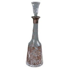 Glass carafe with cap and silver-colored collar