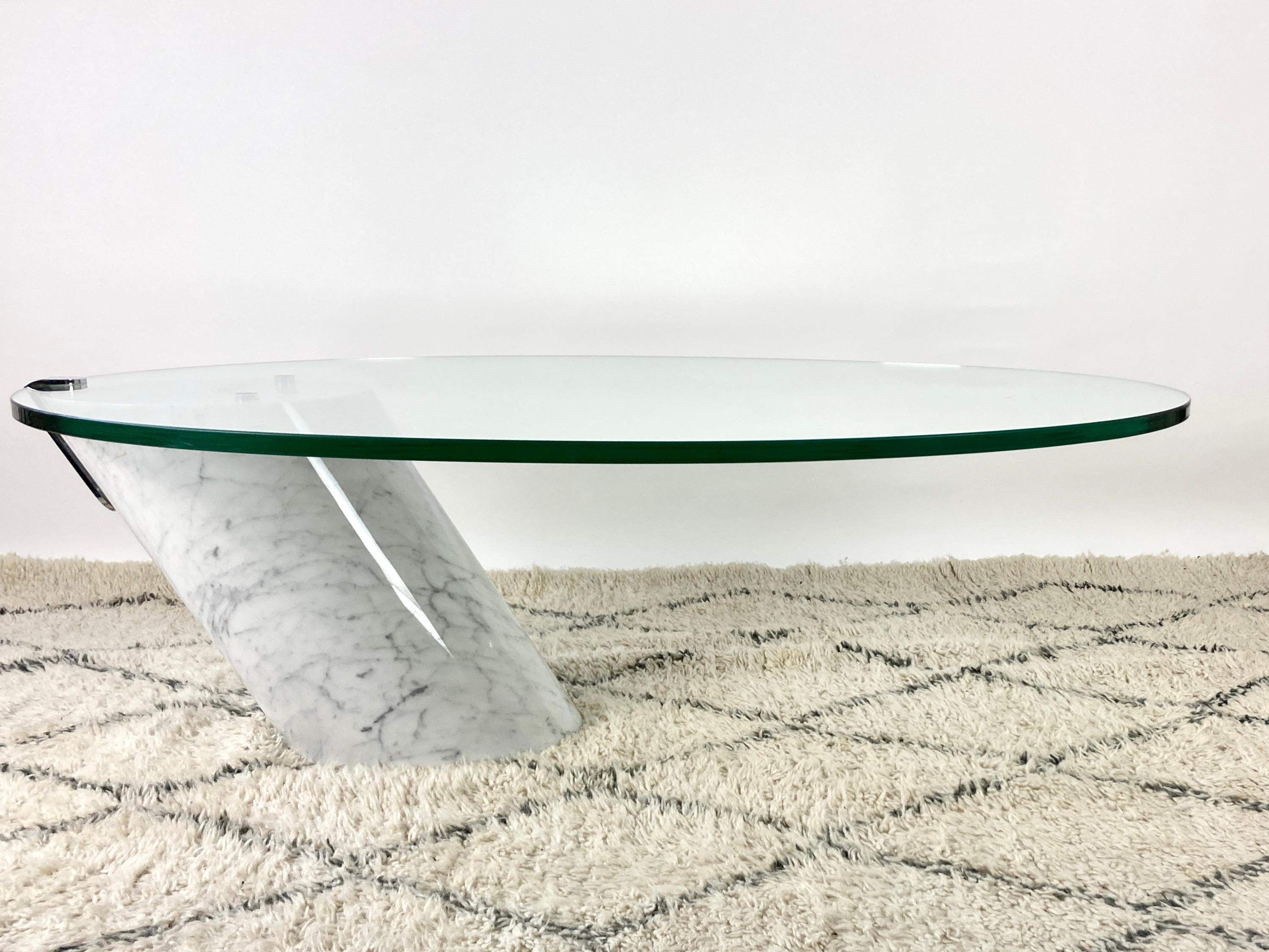 Early 1970s cantilevered coffee table by Ronald Schmitt, Team Form AG, Switzerland. 

Stunning gravity defying design. 

Solid white Carrara marble cylindrical base and thick toughened glass top, held in place by a single metal