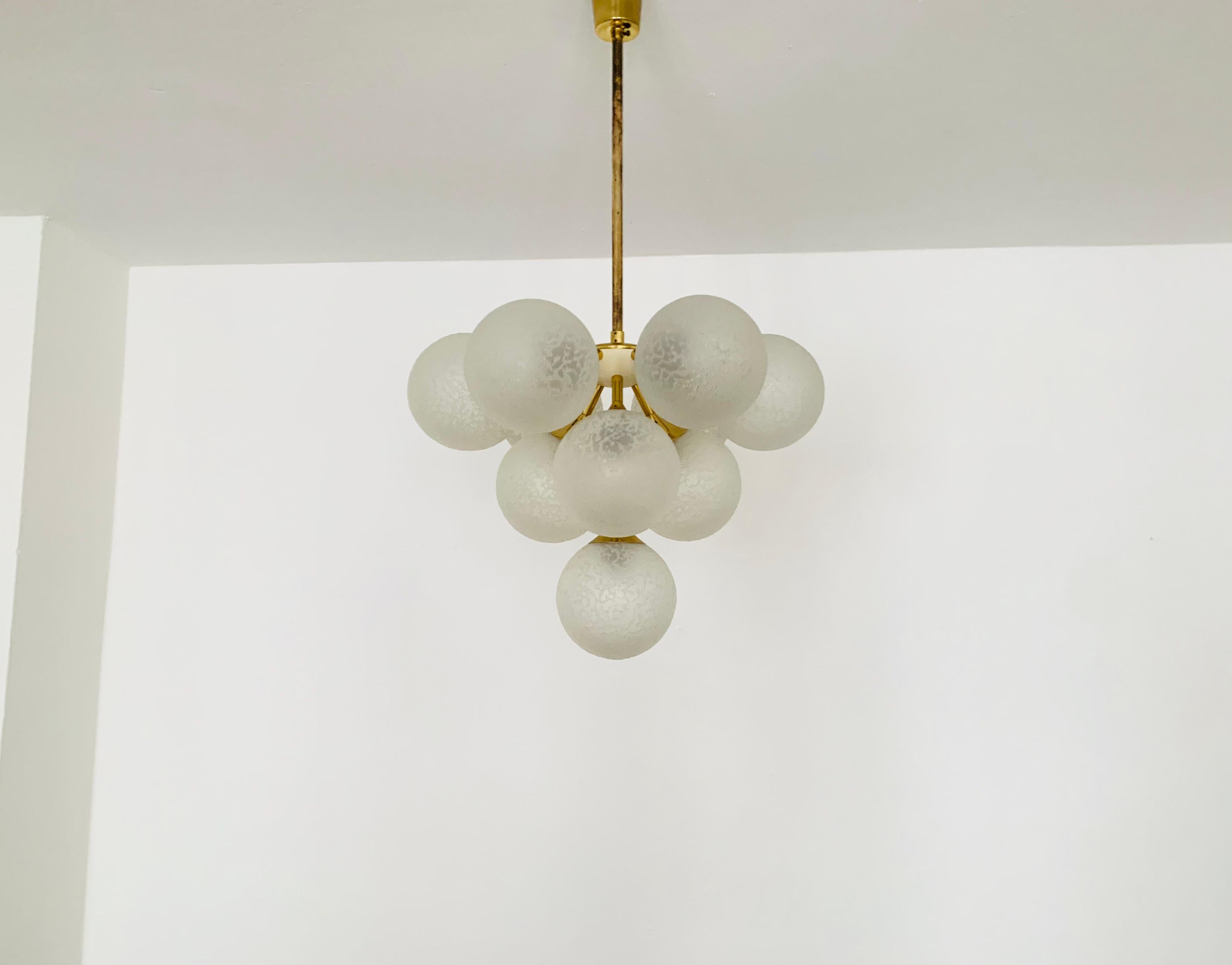Extremely beautiful and rare Sputnik chandelier from the 1960s.
The 10 special lampshades spread a pleasant light.
The lamp has a very high quality finish.
Very contemporary design with a fantastic look.

Condition:

Very good vintage