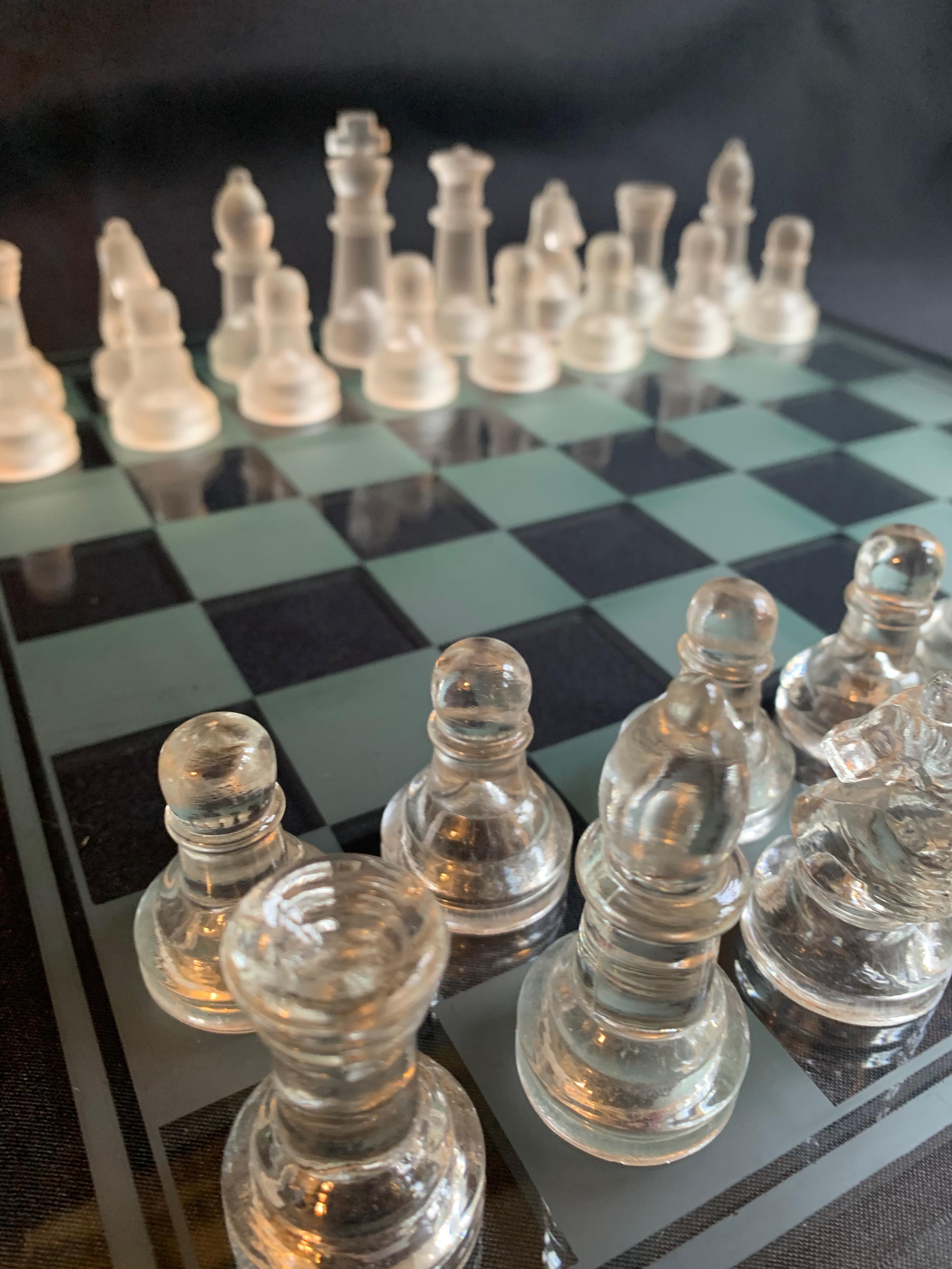 A wonderful glass chess set, a wonderful addition to the game room. Glass is in very good condition and doesn't look to be molded (no mold lines). The piece sparkles in the right light and is impressive as a decorative piece

For size of board see