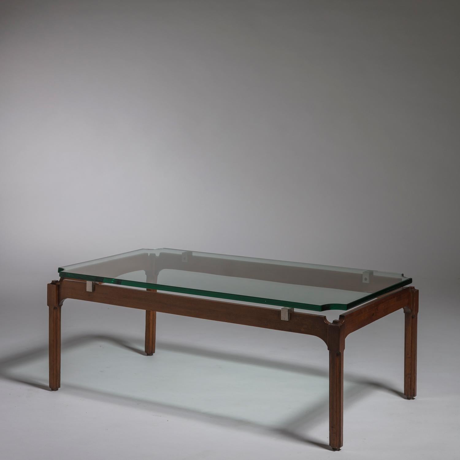Rare low table by Adelmo Rascaroli.
Wood frame with accurate details, brass details and glass top with rounded edges.
