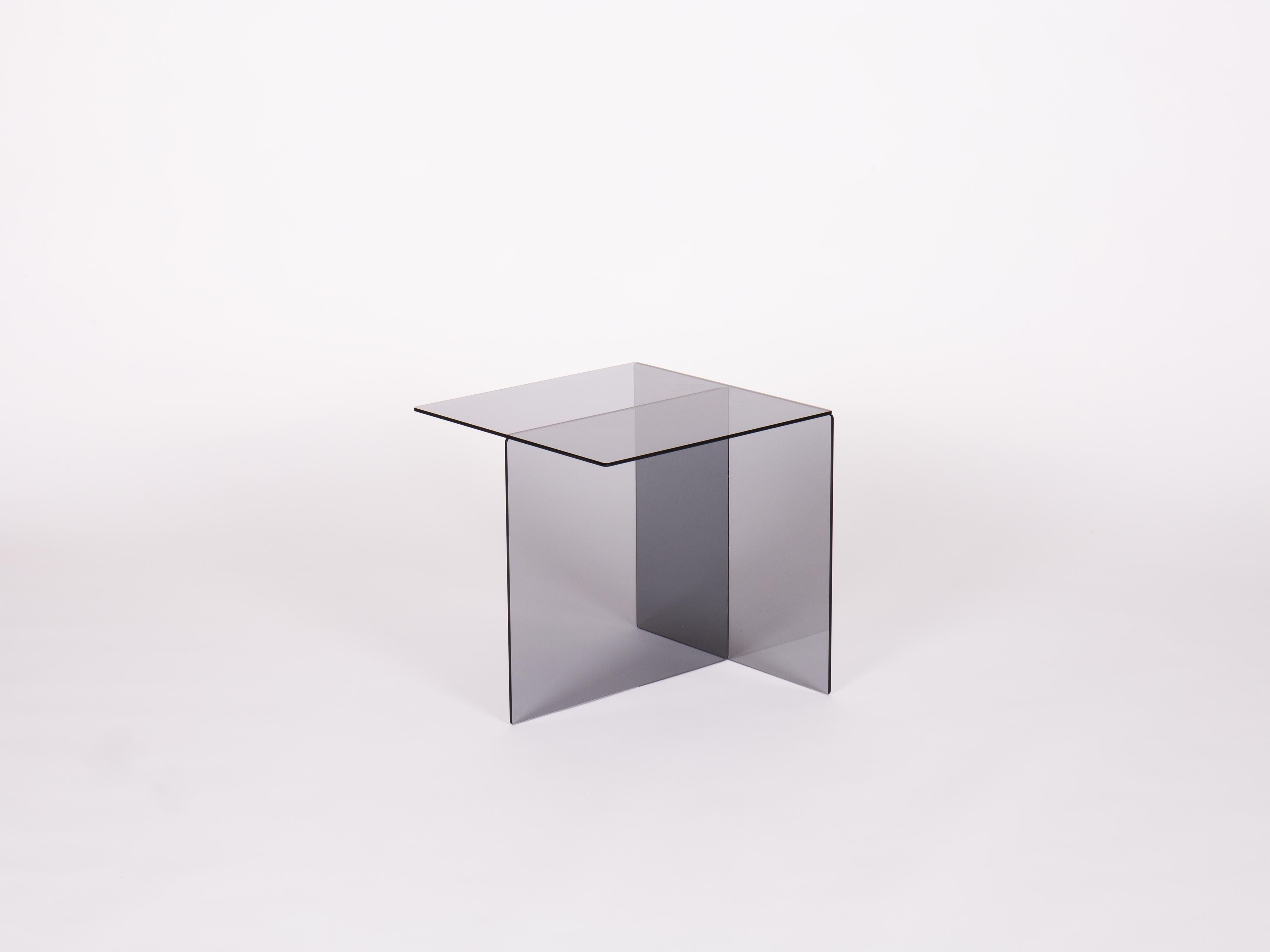 Designed in 1967 - Paradisoterrestre Edition 2023

Materials: glass

Colours: smoked grey or bronze 

Designed by Augusto Betti in 1967, Glass coffee table consists of a smoked glass element whose cubic conformation allows for different