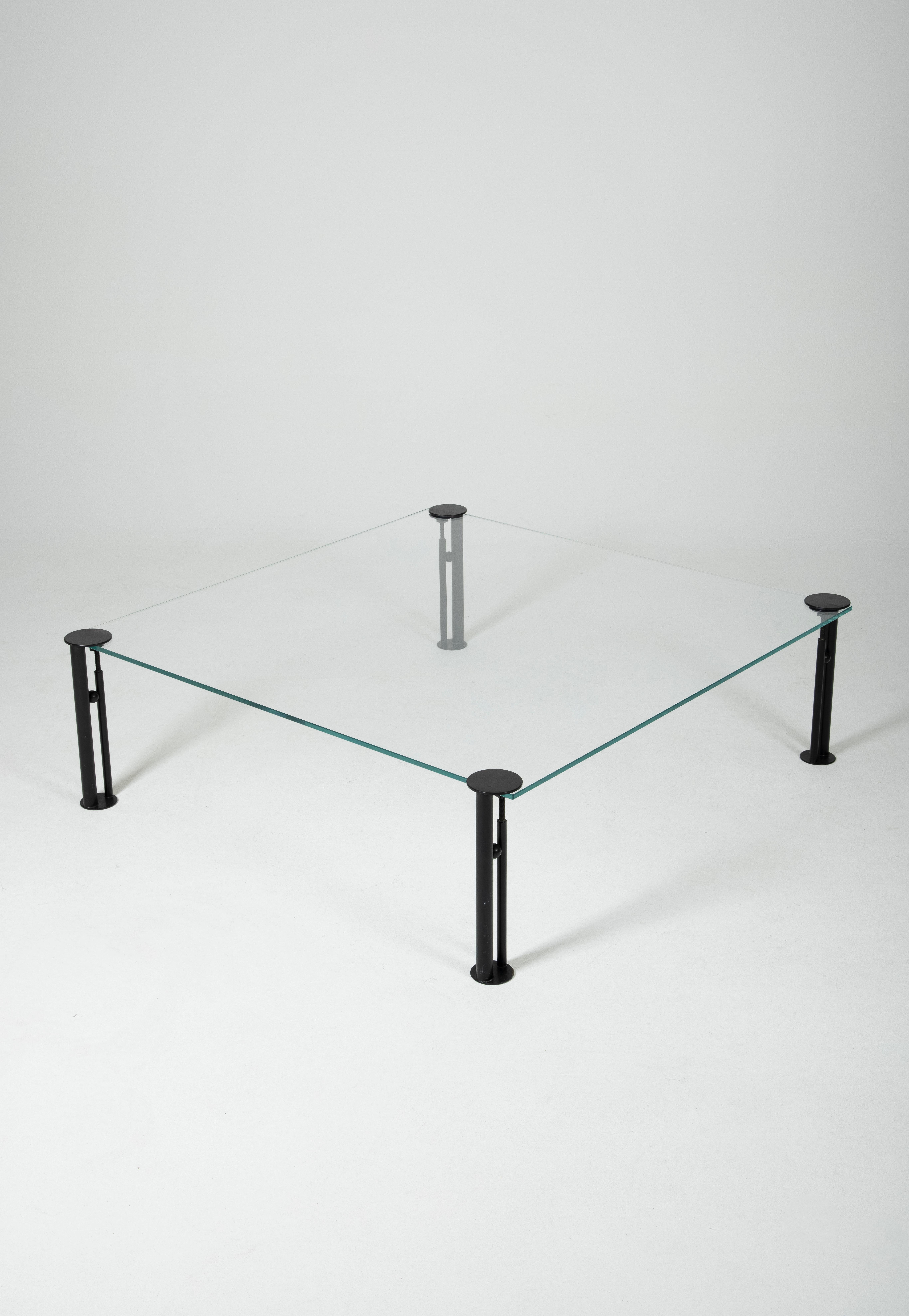 Coffee table Joe Ship by Philippe Starck, 1982. It consists of a square glass top and four adjustable black metal legs. The name of this model, Joe Ship, refers to a character from the novel Ubik by Philip K. Dick. 
Very good condition.
LP617