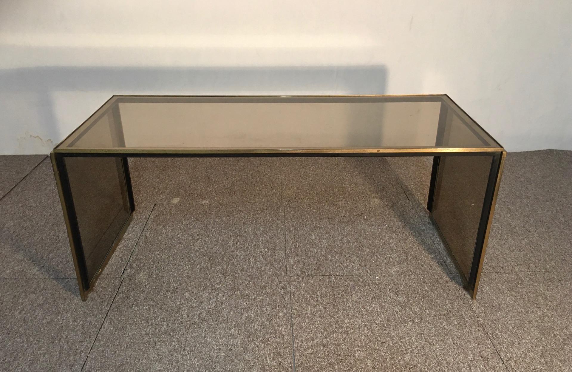 Glass coffee table, Italy, designer Romeo Rega, 1970, Structure in brass and black iron, smoked glass. Very refined.