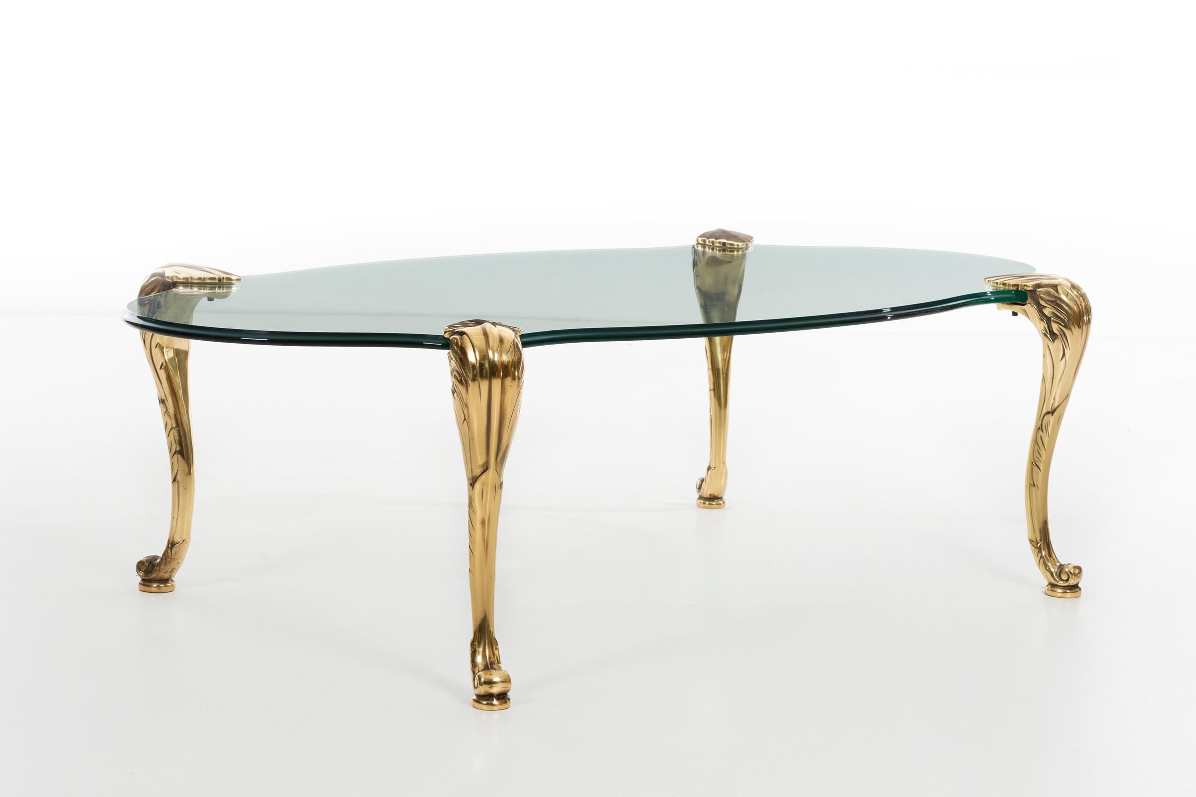 glass coffee table with brass legs