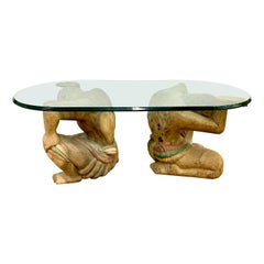 Glass Coffee Table with Pair of Carved Wood Figural Men Base