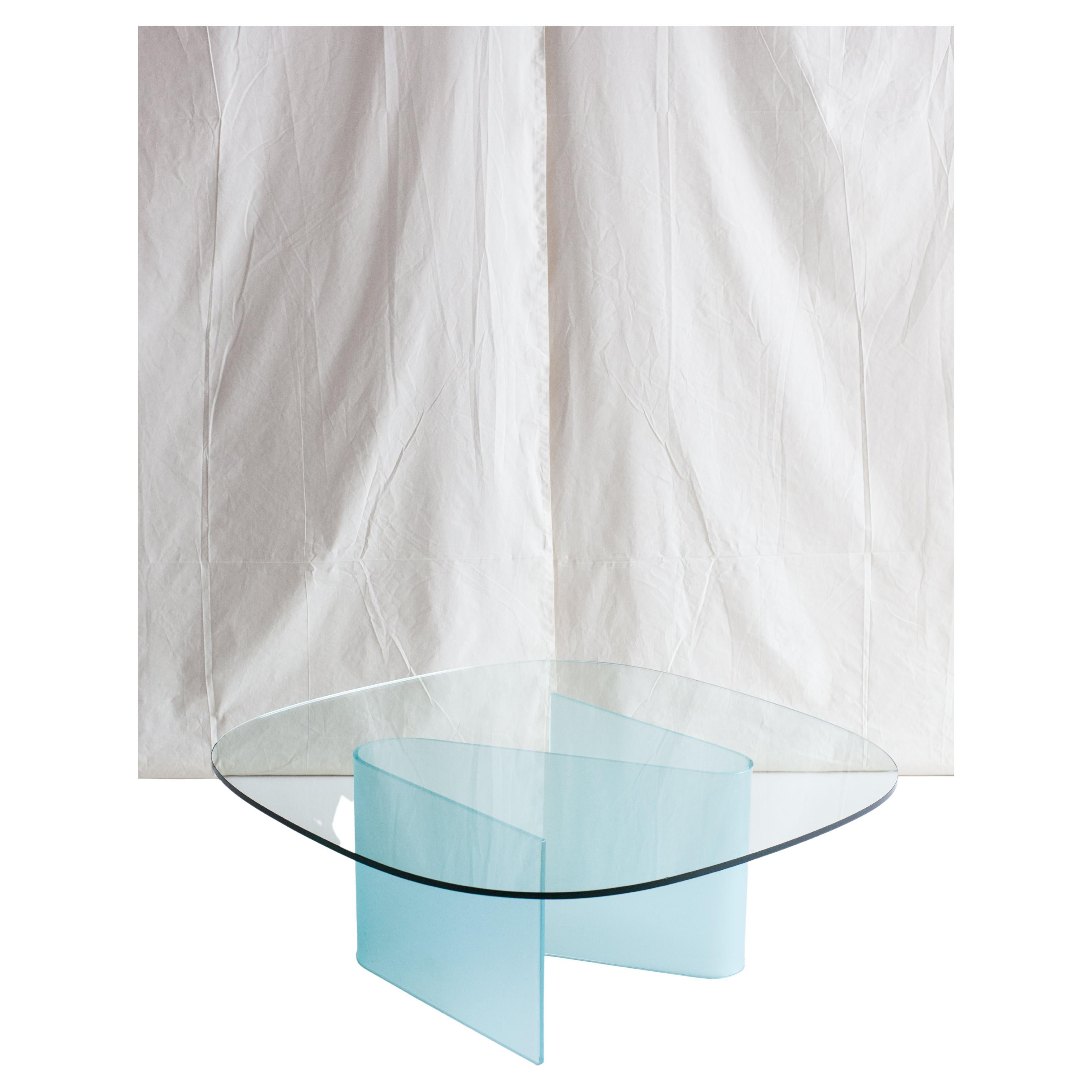 Beautiful glass coffee table with s-shaped frosted glass base.

We have another glass beauty for you. One that will blend in easily with any environment, while still drawing attention to itself given its unique design. The two types of glass make