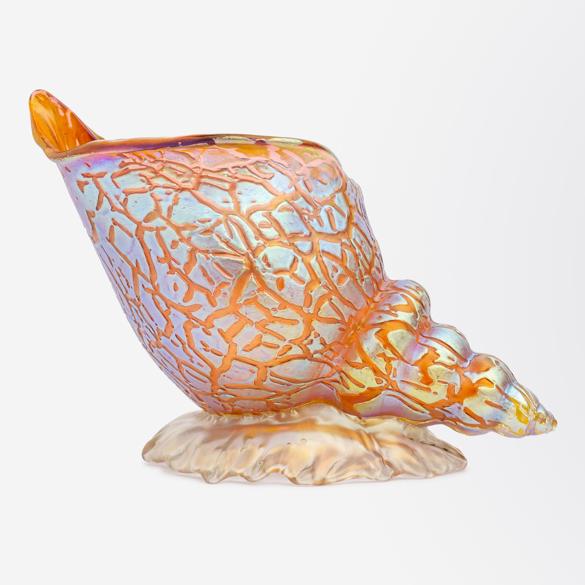 An Austrian glass conch shell by Bohemian glass maker, Loetz in the pink ground with mimosa decor, circa 1890. The shell and snail form vases were among the most popular of Loetz's designs and are showcases of the highest quality craftsmanship they