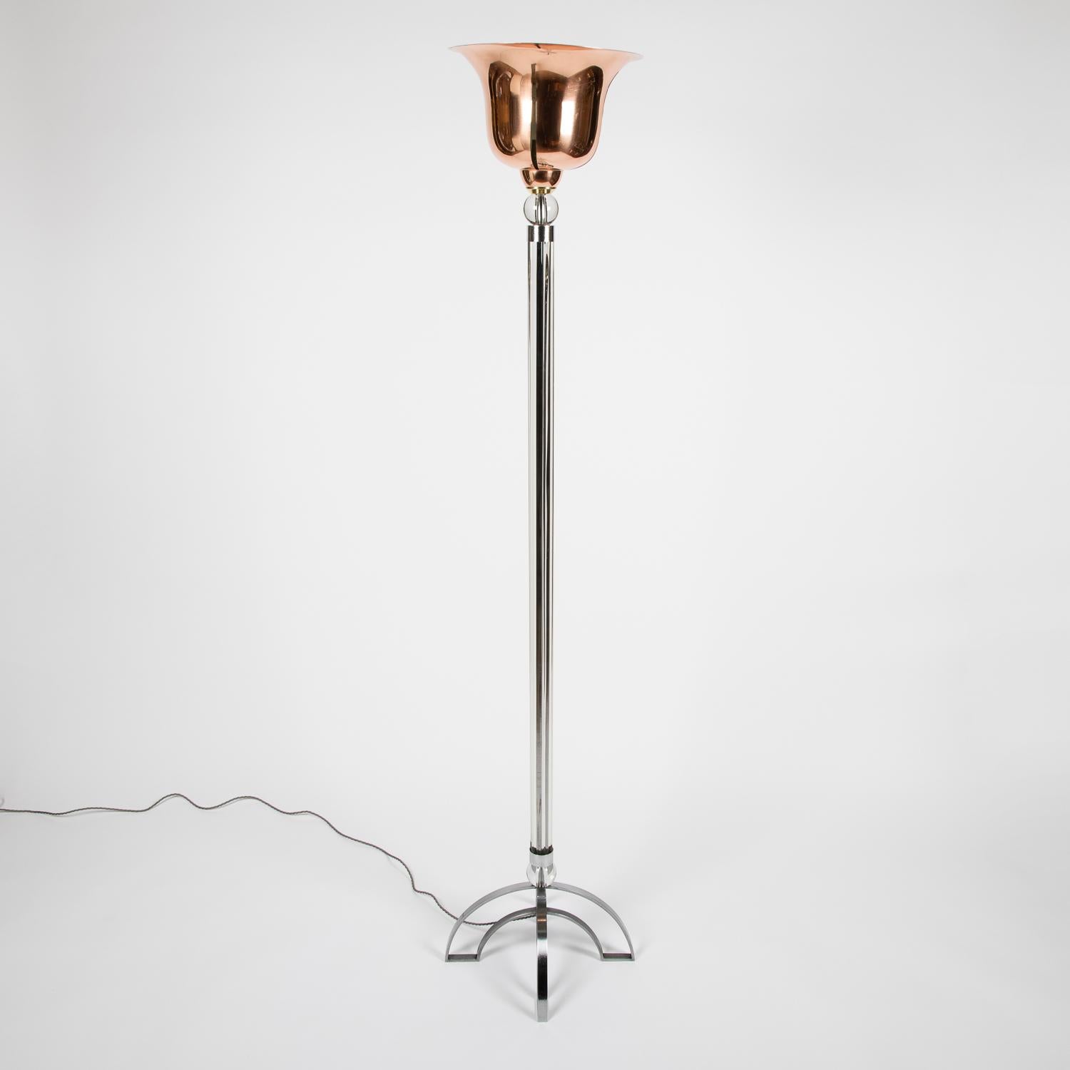 A mid twentieth century glass and copper standard lamp.

Rewired and tested.