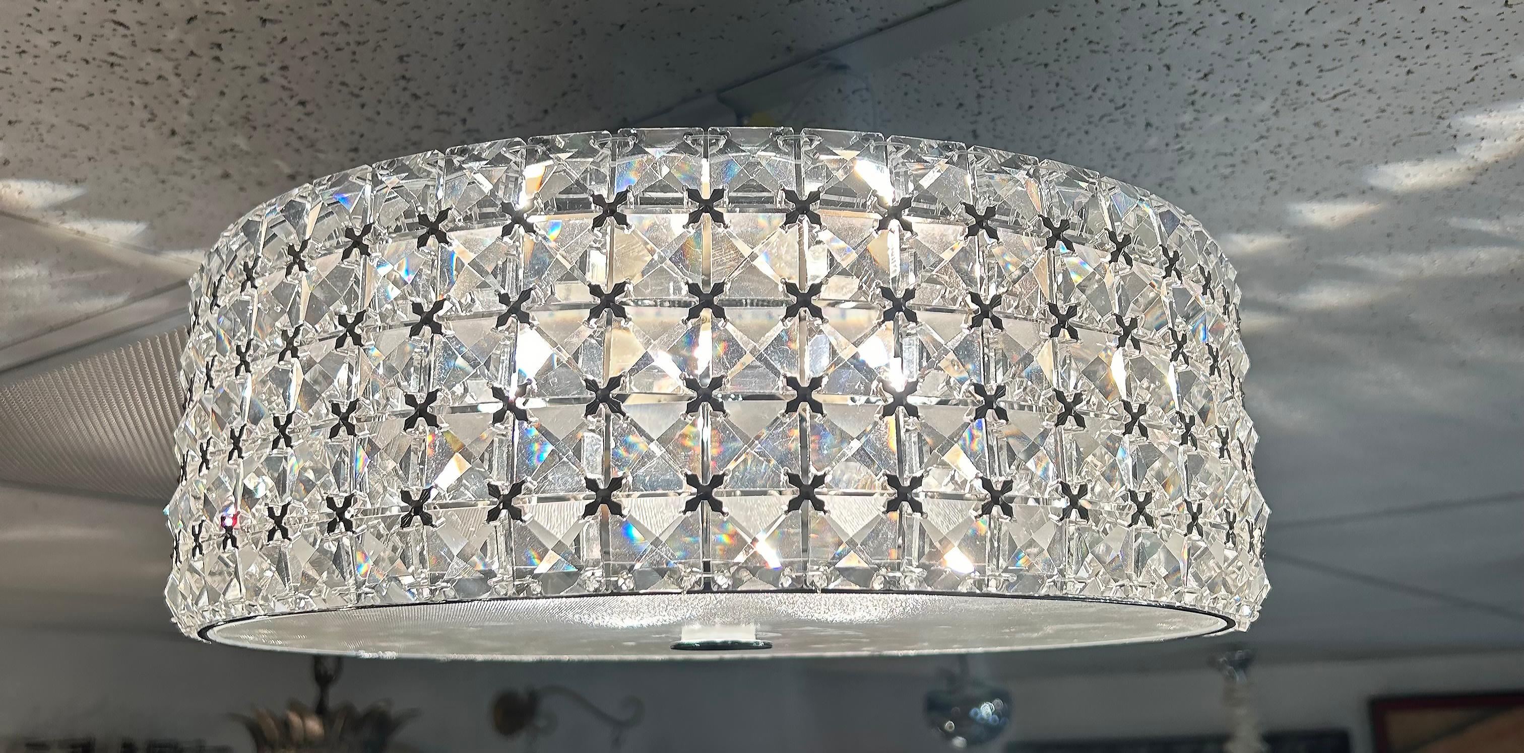 Glass, Crystal and Chrome Flush Mount Ceiling Light Fixture, Wired and Working

Offered for sale is a glass, crystal and chrome flush mount ceiling light fixture.  The fixture is hard-wired and in working condition.  It has a frosted glass diffuser