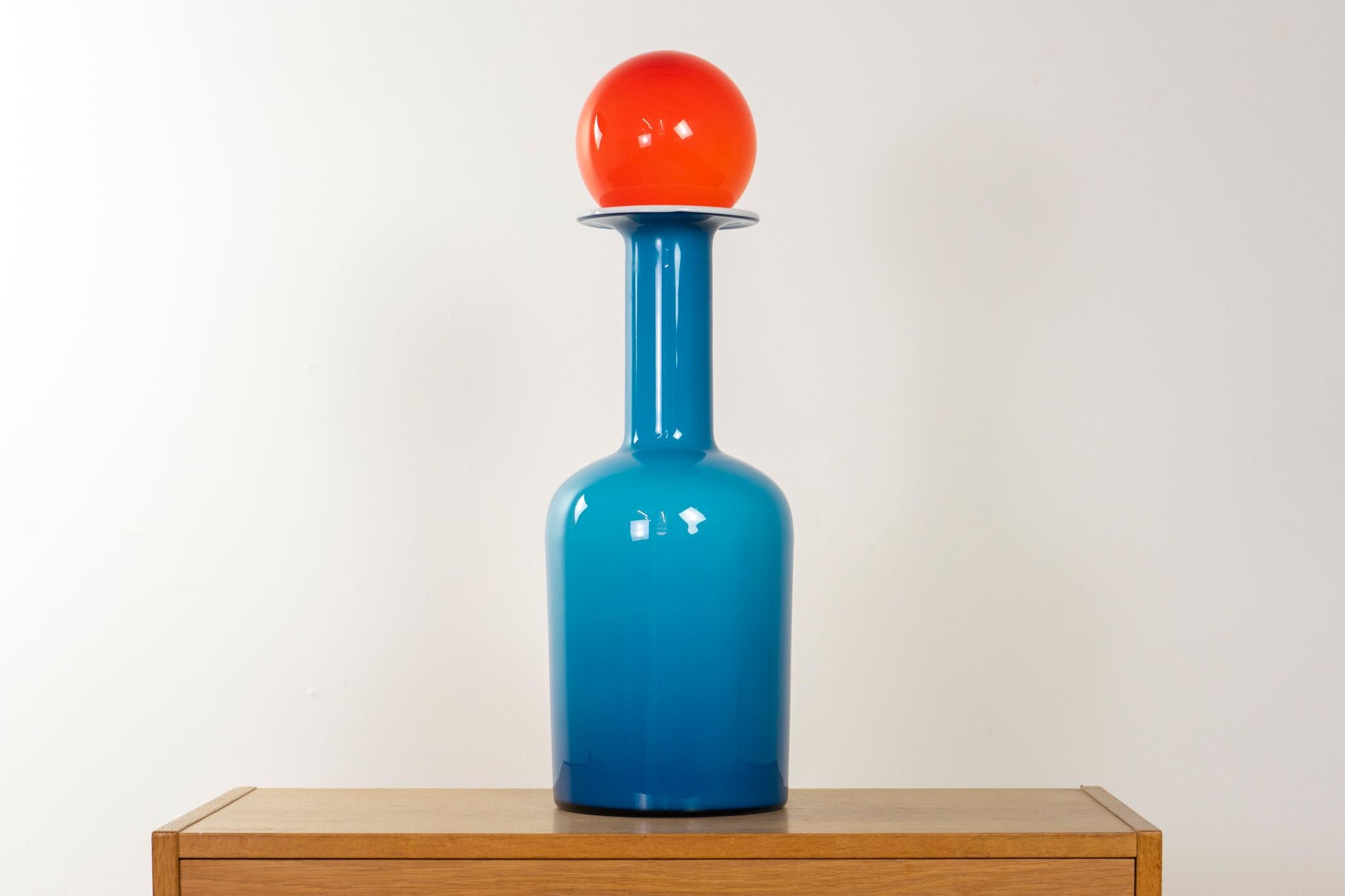 Glass Danish Gulvase vase by Otto Brauer for Holmegaard, circa 1960s. Glorious blue and opal white cased glass with bright orange topper sphere. Add a POP of color to your abode! 