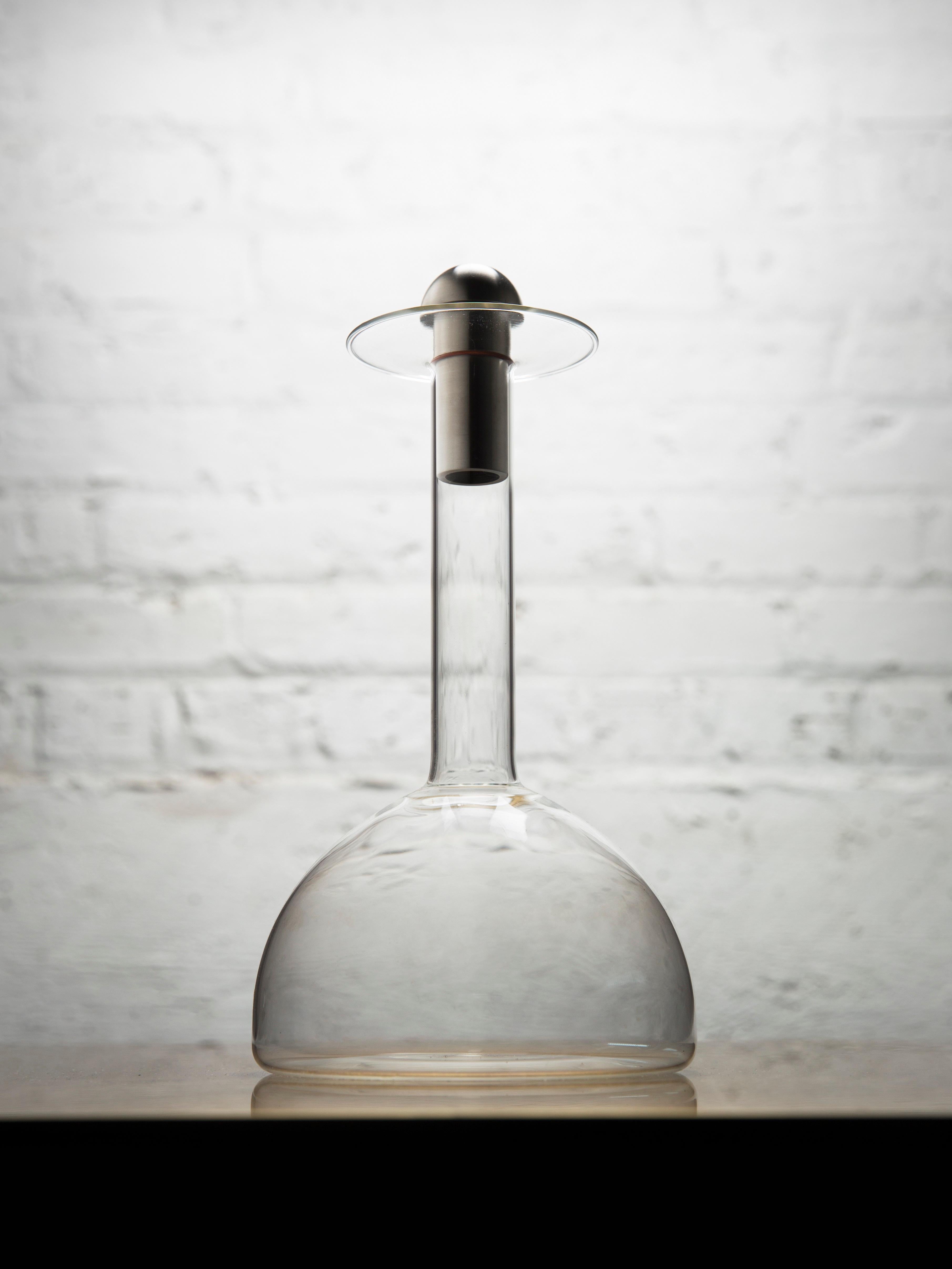 Glass decanter by Gentner Design
Dimensions: D 15.2 x H 28 cm
Materials: glass, brass

A place to ready the tastes and hidden intoxicating offerings of your libation to the evening.

Gentner Design
Rooted in a language of sculpture, character