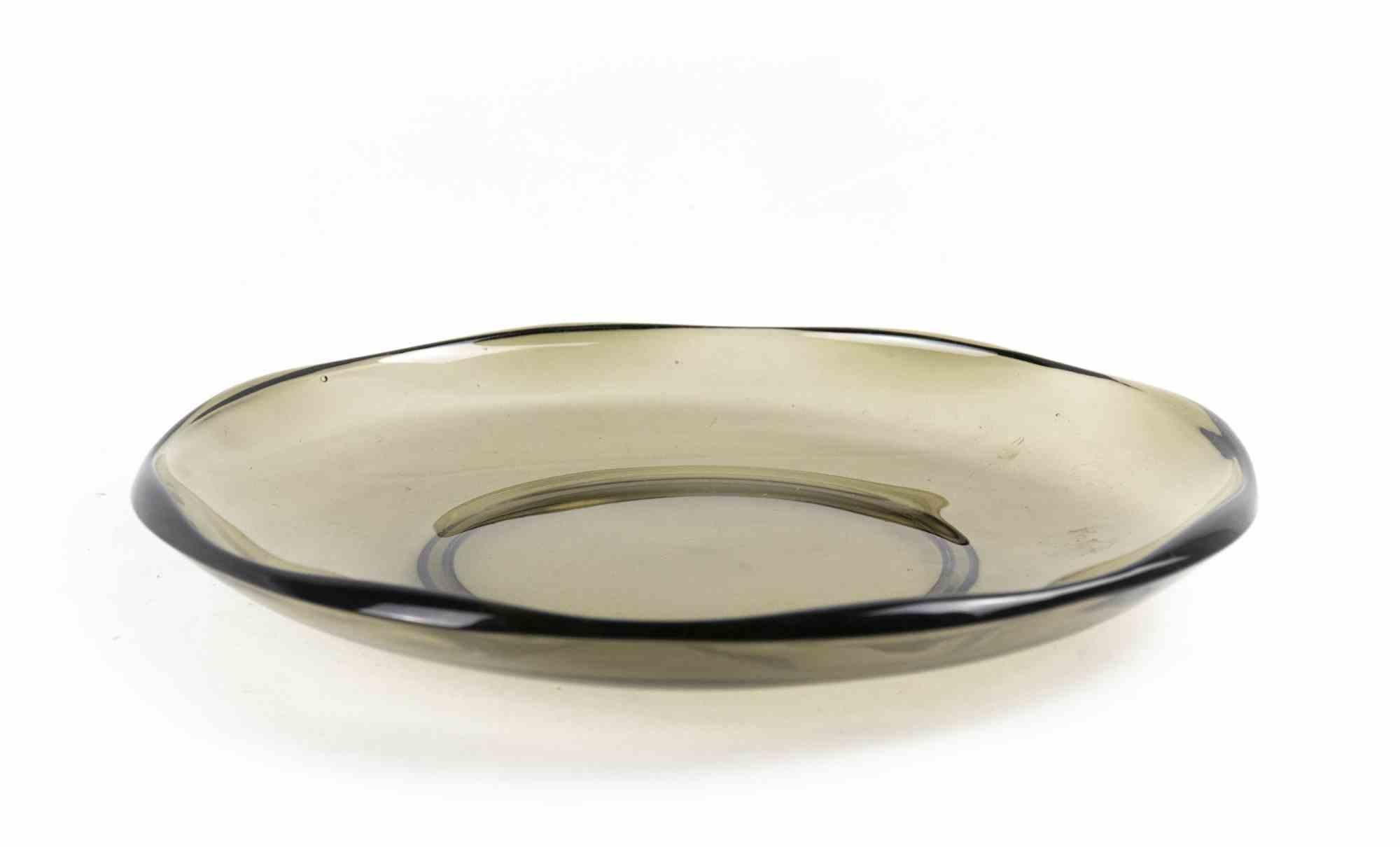 Glass decorative plate is an original decorative object realized in the 1970s.

Original Art Glass. Fumé glass.

Made in Italy.

Total dimensions: 4 x 30 x 30 cm.

Mint conditions.
