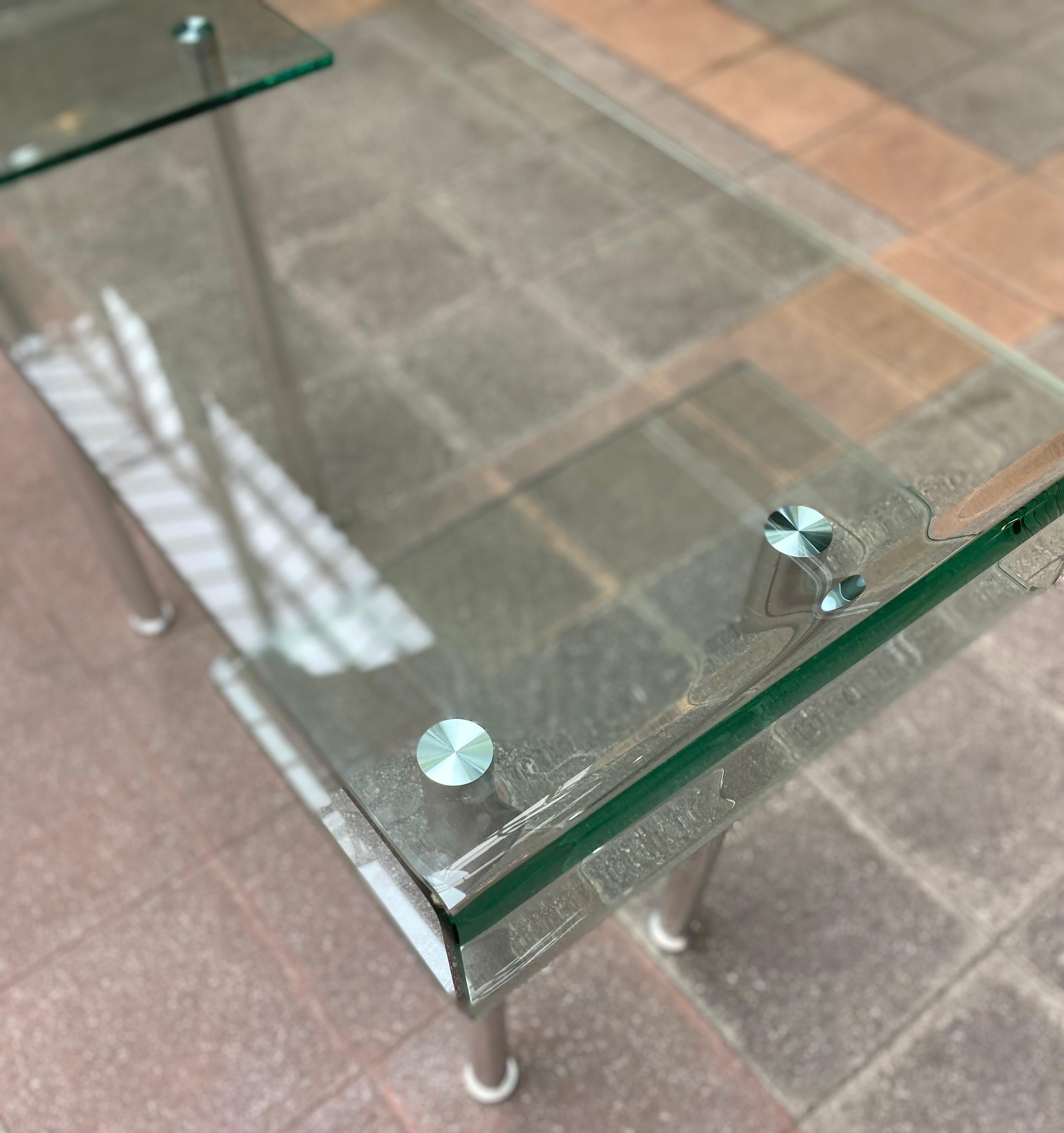 Glass desk 
Gae Aulenti ( dlg )
Glass and stainless steel 
1980
Measures: W 99 cm x D 40 x H 76 cm
Price : 1600 € for a desk.