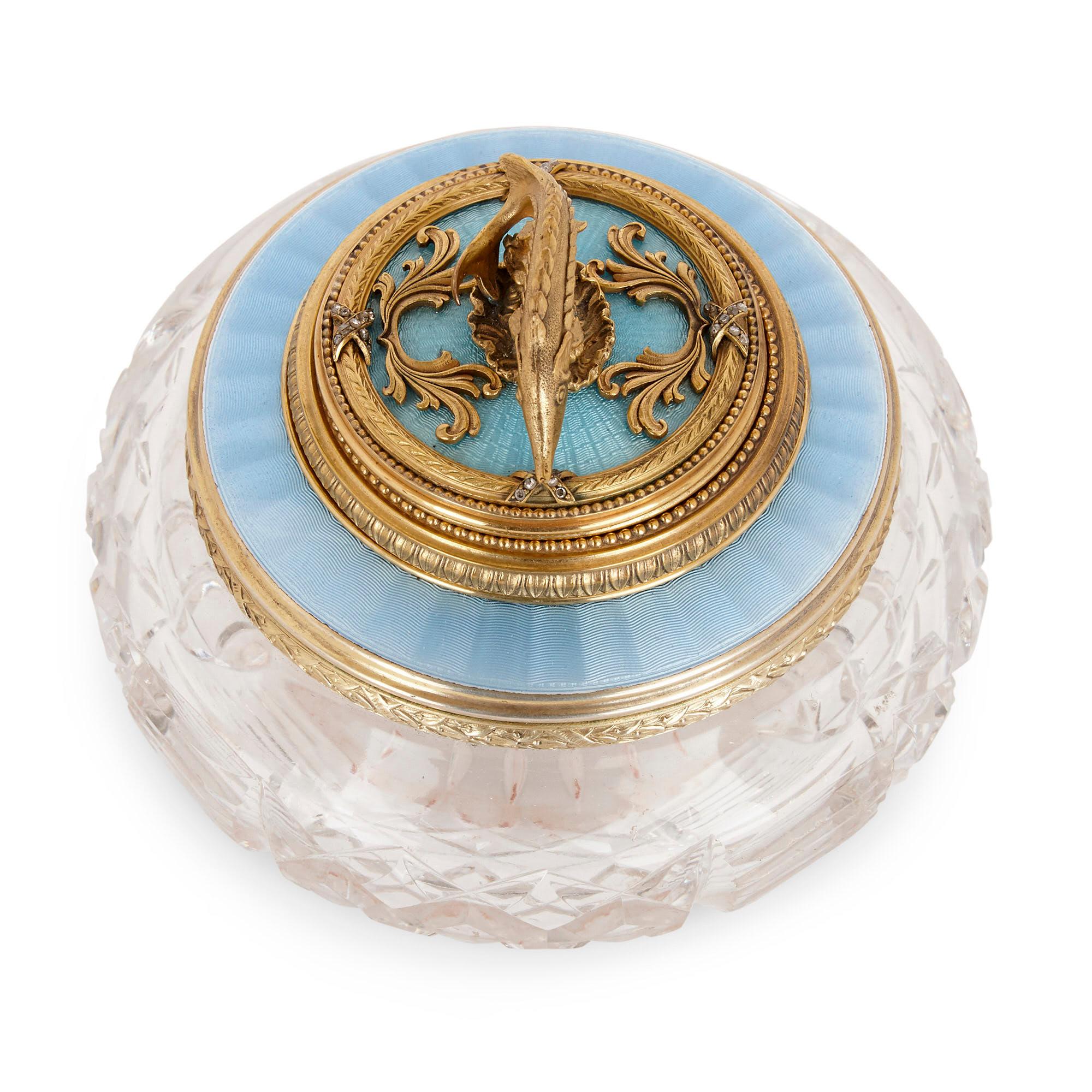 Produced in the manner of the celebrated Russian jeweler Fabergé, this wonderful little object is a container for caviar—a fact made patently clear by the delicately wrought sturgeon finial that surmounts the lid.

The piece is crafted from the
