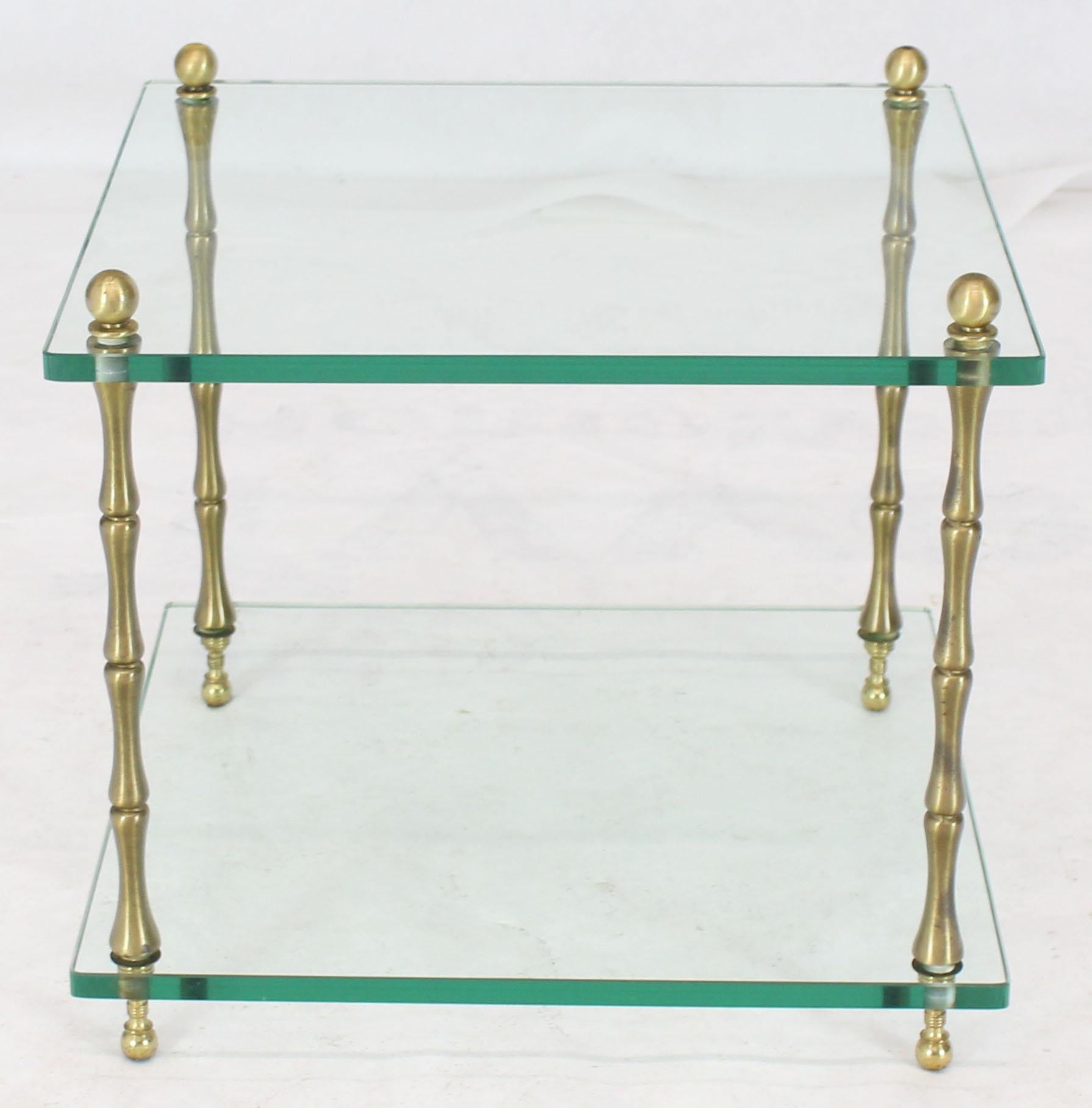 Mid-Century Modern thick glass cube shape side table connected with four brass faux bamboo rods and ball finials.