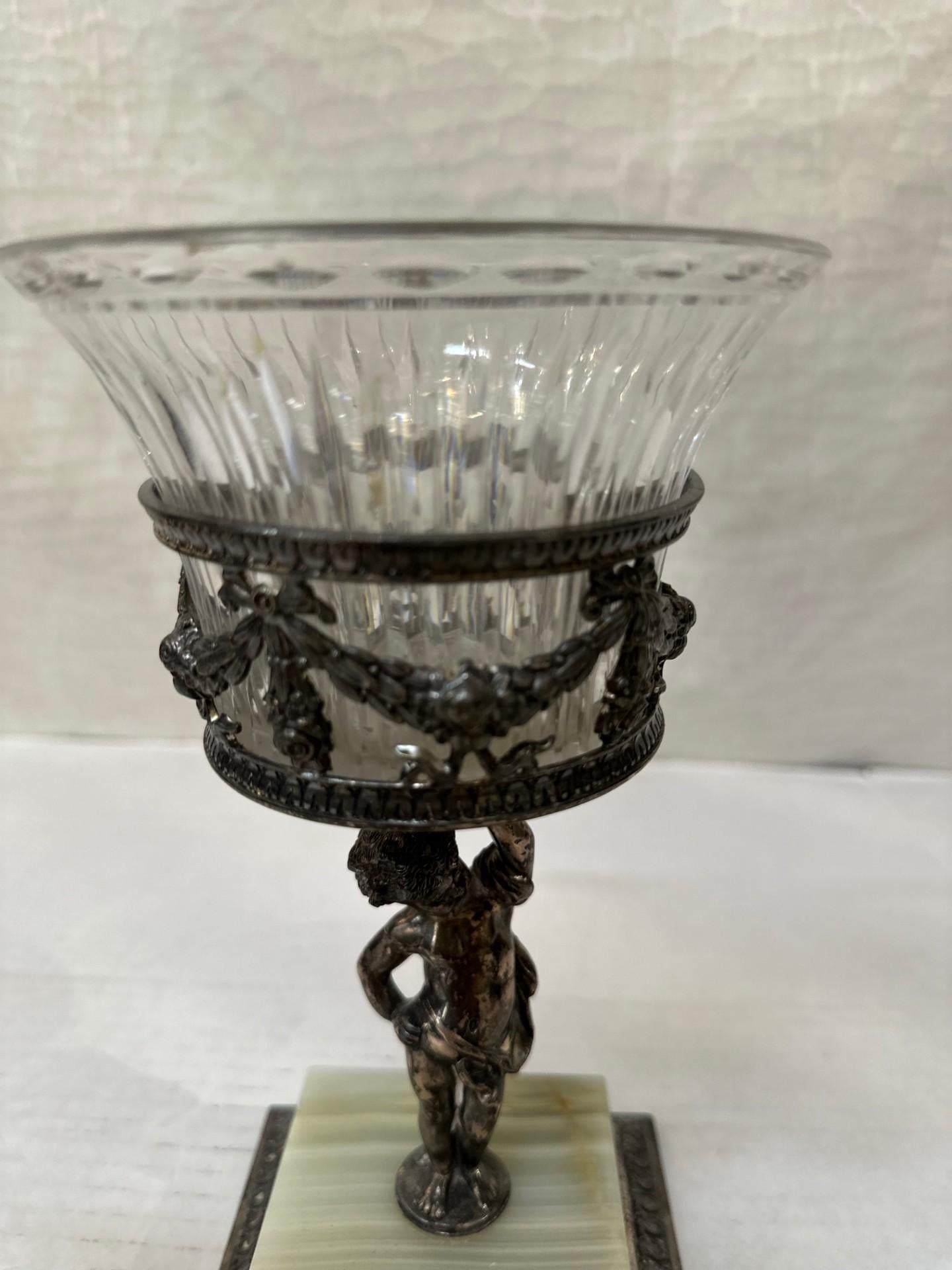 This centerpiece has a silver-plate and onyx base. 