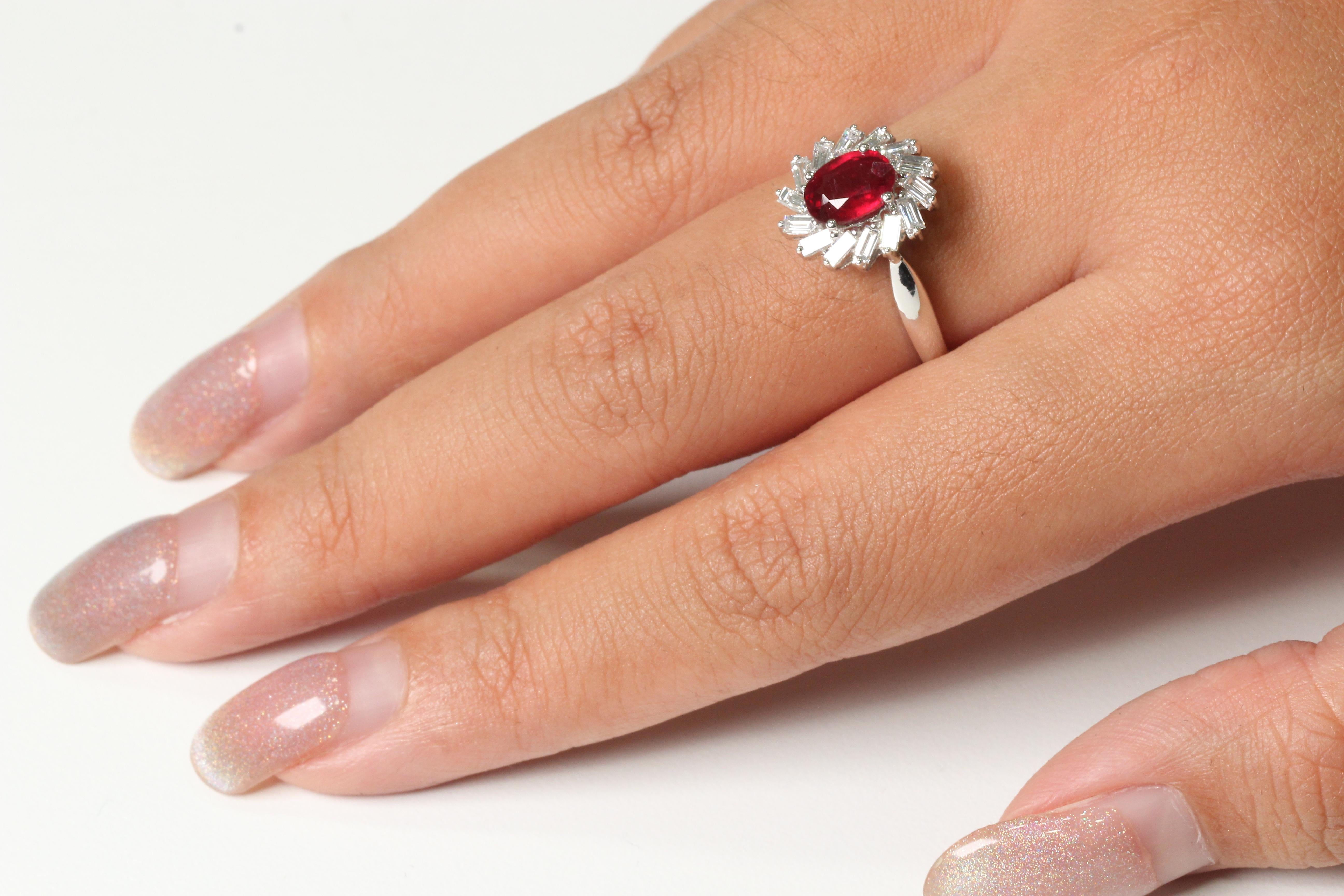  With this ring, you can be sure to grab everyone's attention. This piece is made up of a glass filled ruby stone and diamond stones in an antique style setting. The combination of these materials and the design of this ring make it stand out from