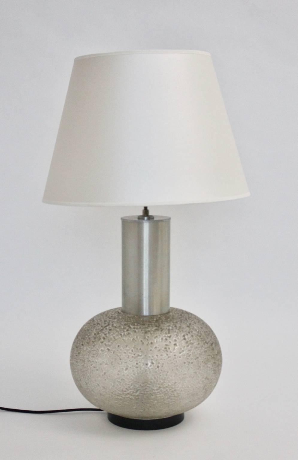 Space age vintage glass floor lamp by Doria 1970s, Germany great for using as a floor lamp and also as a table lamp.
Also the lamp features a paper label underneath - no 1240 10.
The base was made of textured and etched glass and is shaped like a