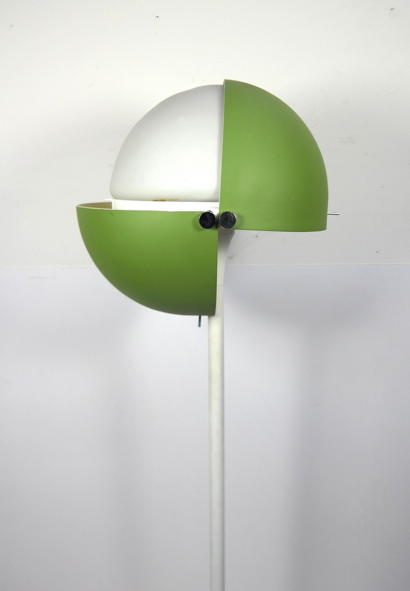 Sixties standing lamp, with a closeable steel top, painted metallic green, and a glass shade, electronically restored. As shown on the photos, in the originally vintage exhibition catalouge it was first exhibited in 1974.